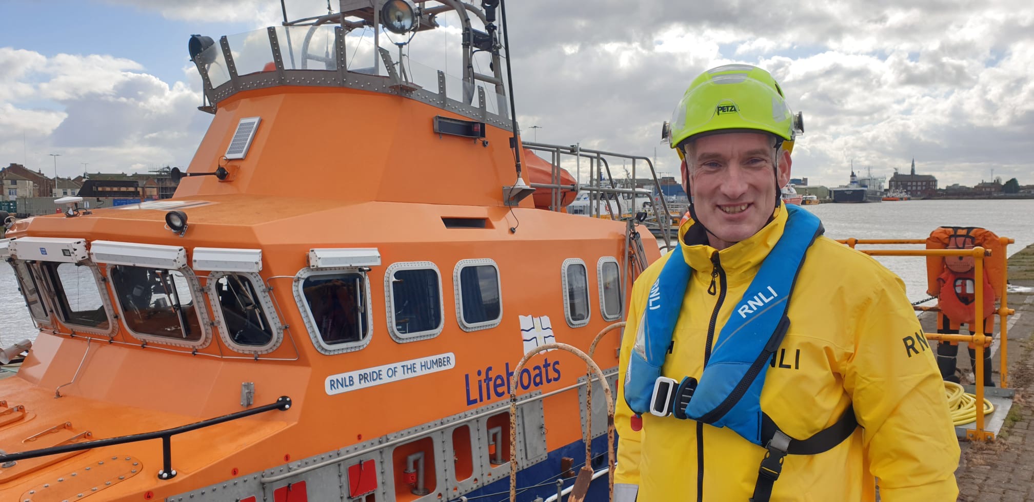 David 'Scotty' Scott Humber RNLI Lifeboat Operations Manager in front of Humber RNLI Severn class lifeboat