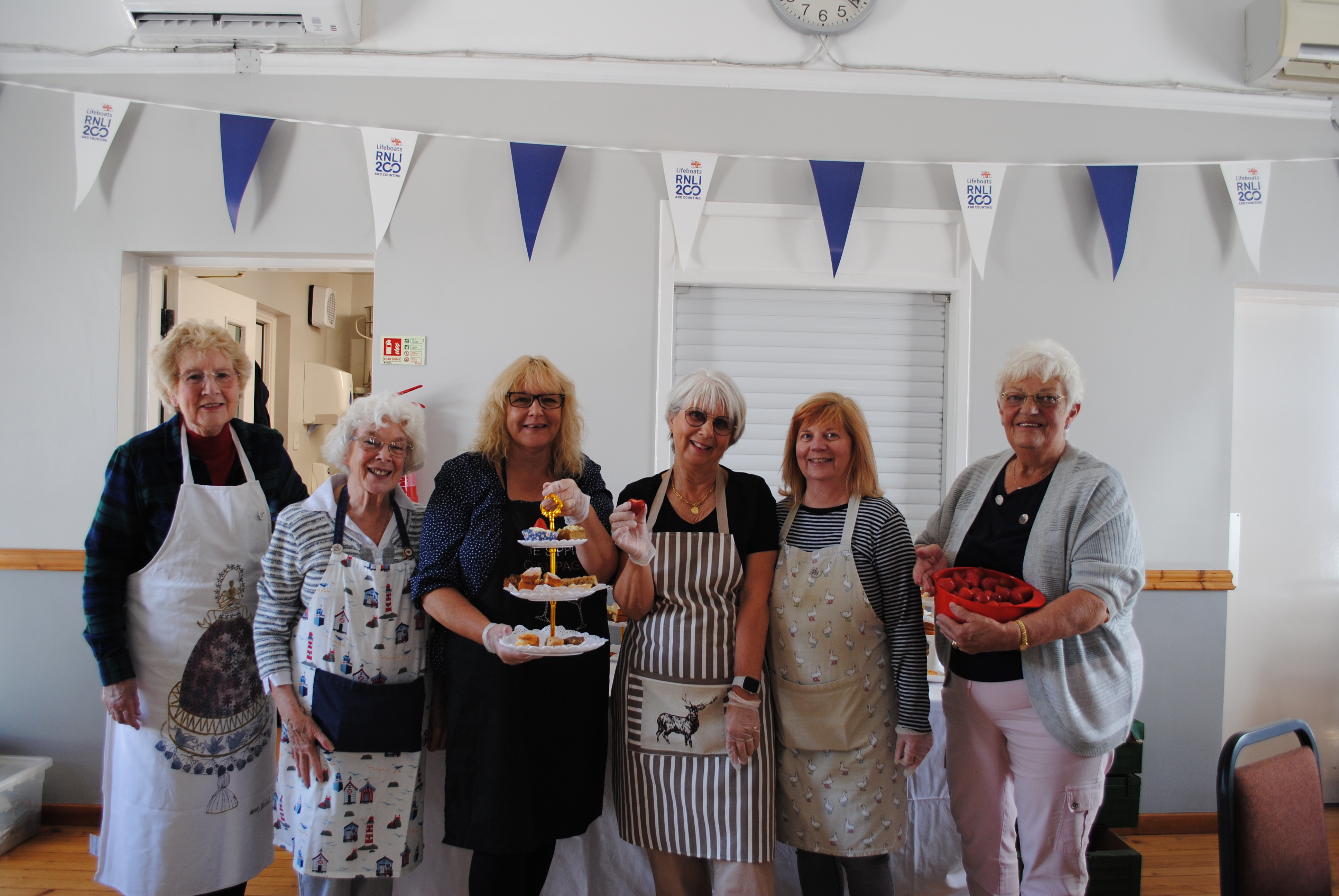 Strawberry tea fundraisers - Myrna and Marion both at the right.
