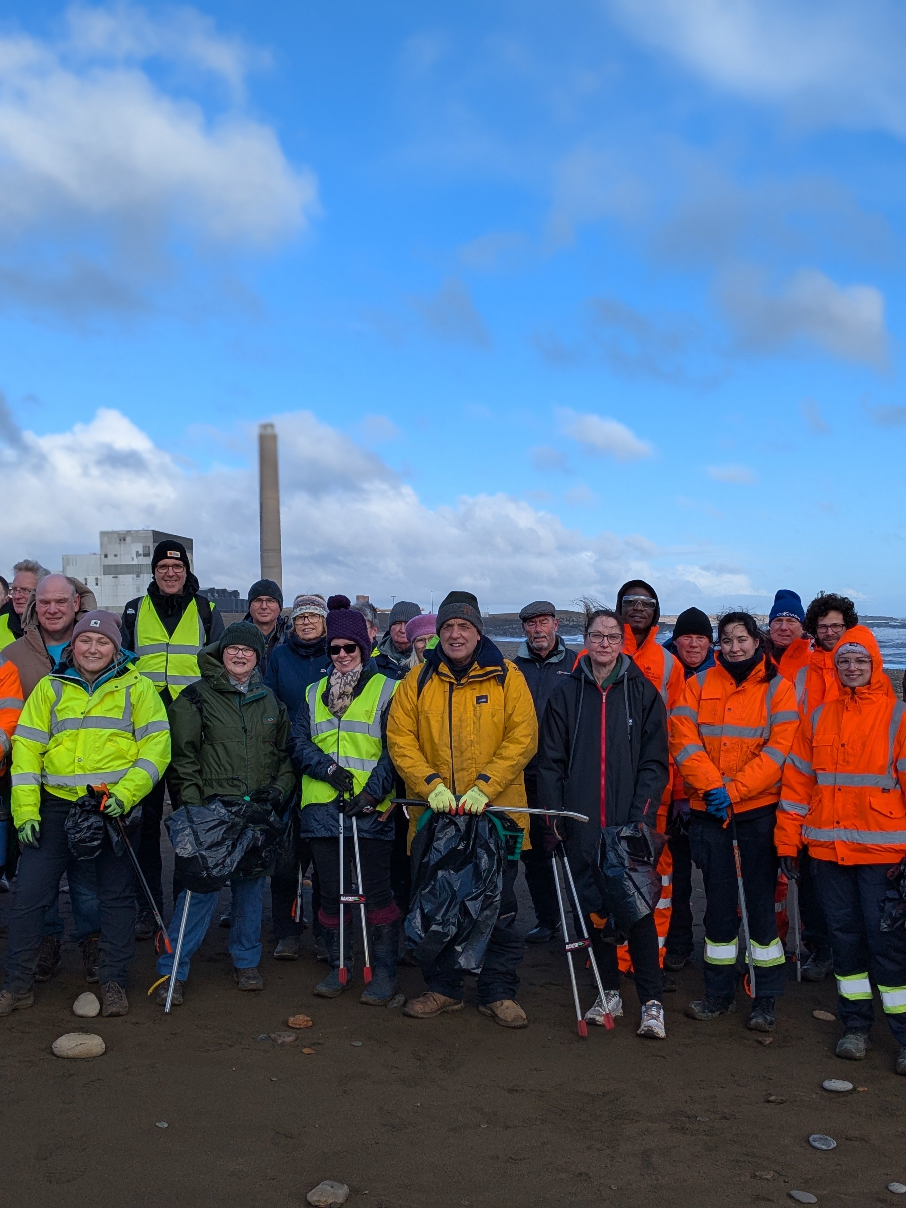 Volunteers preparing to start cleaning the beach