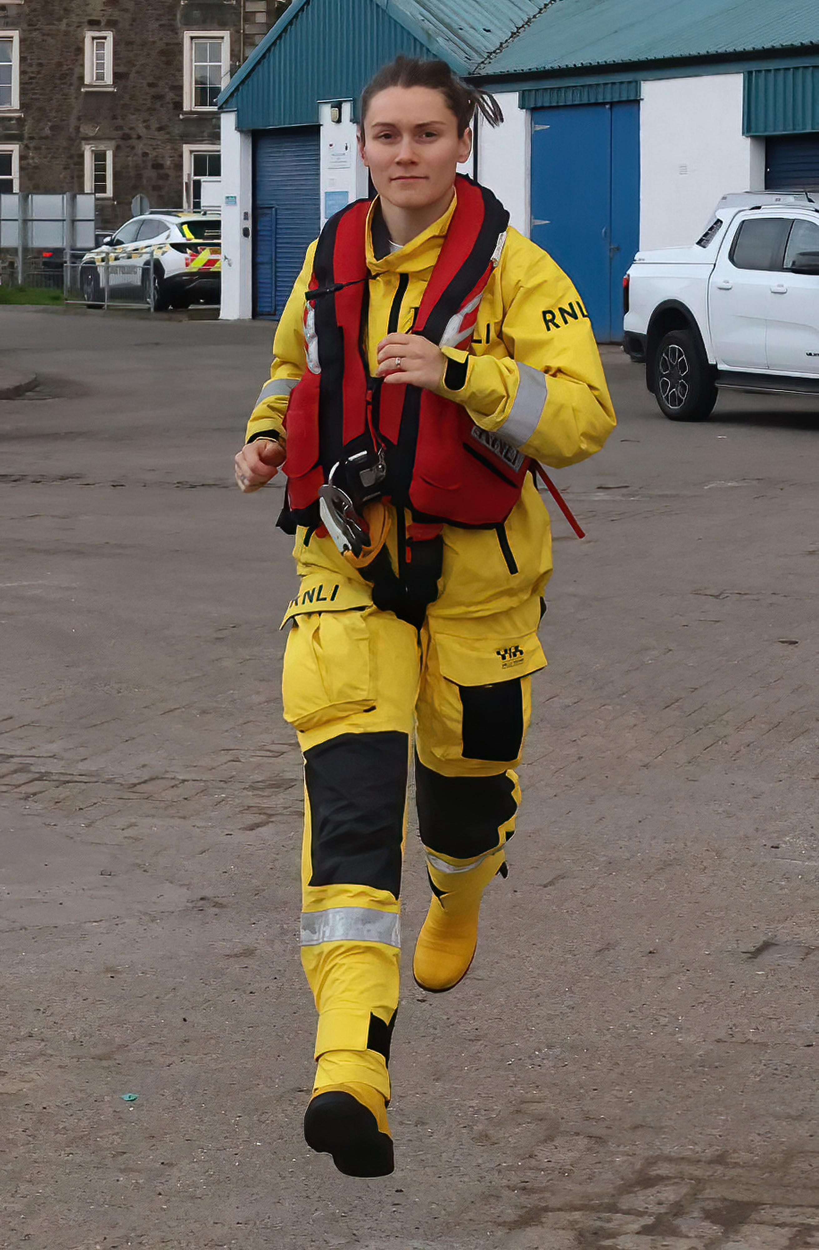 Jasmin Manning running towards the camera in full kit