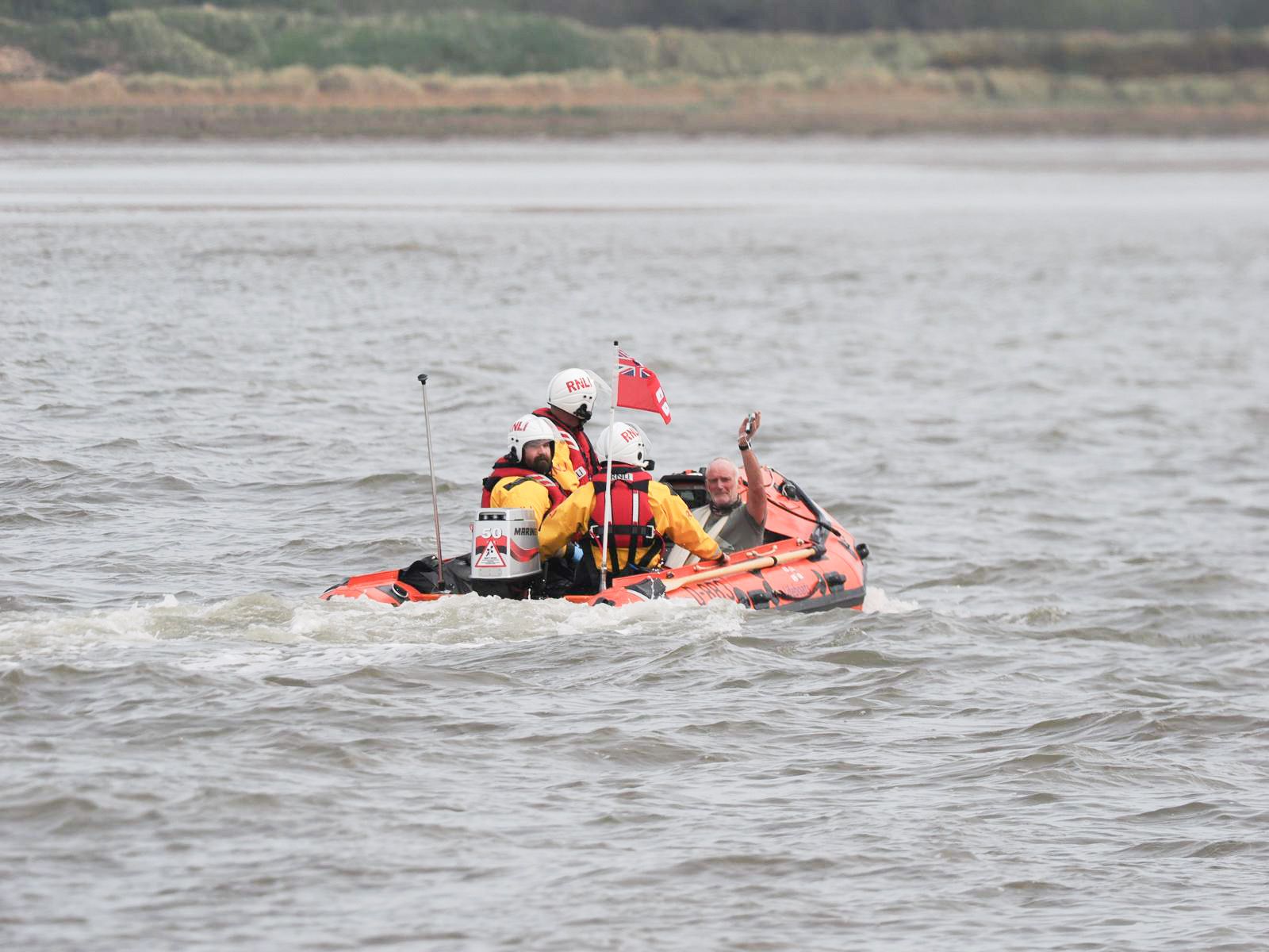 Crew with Casualty heading back to shore