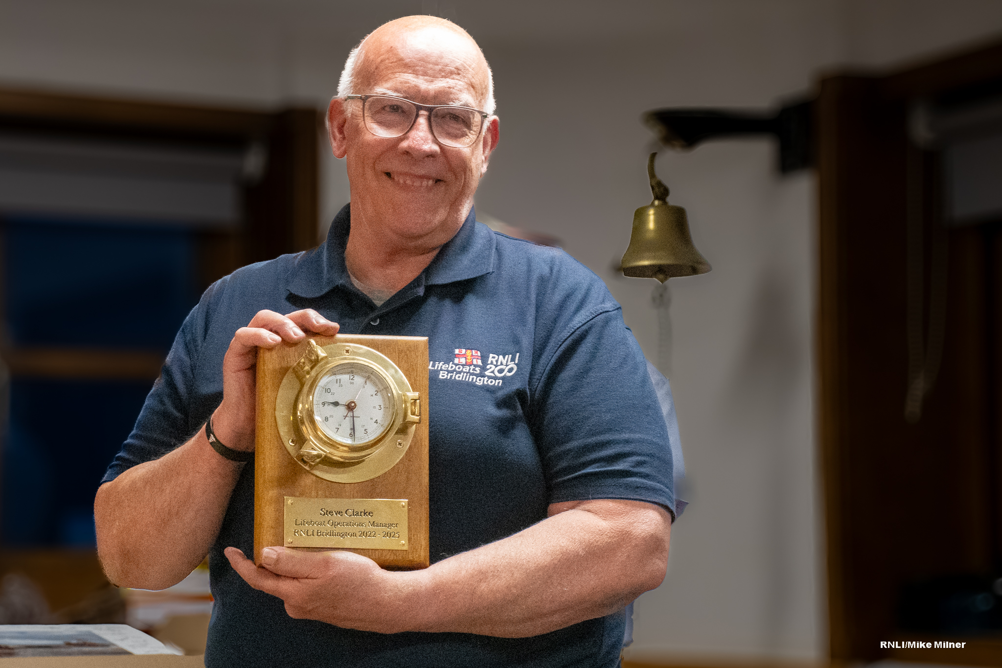 Steve Clarke presented with brass clock and plaque.