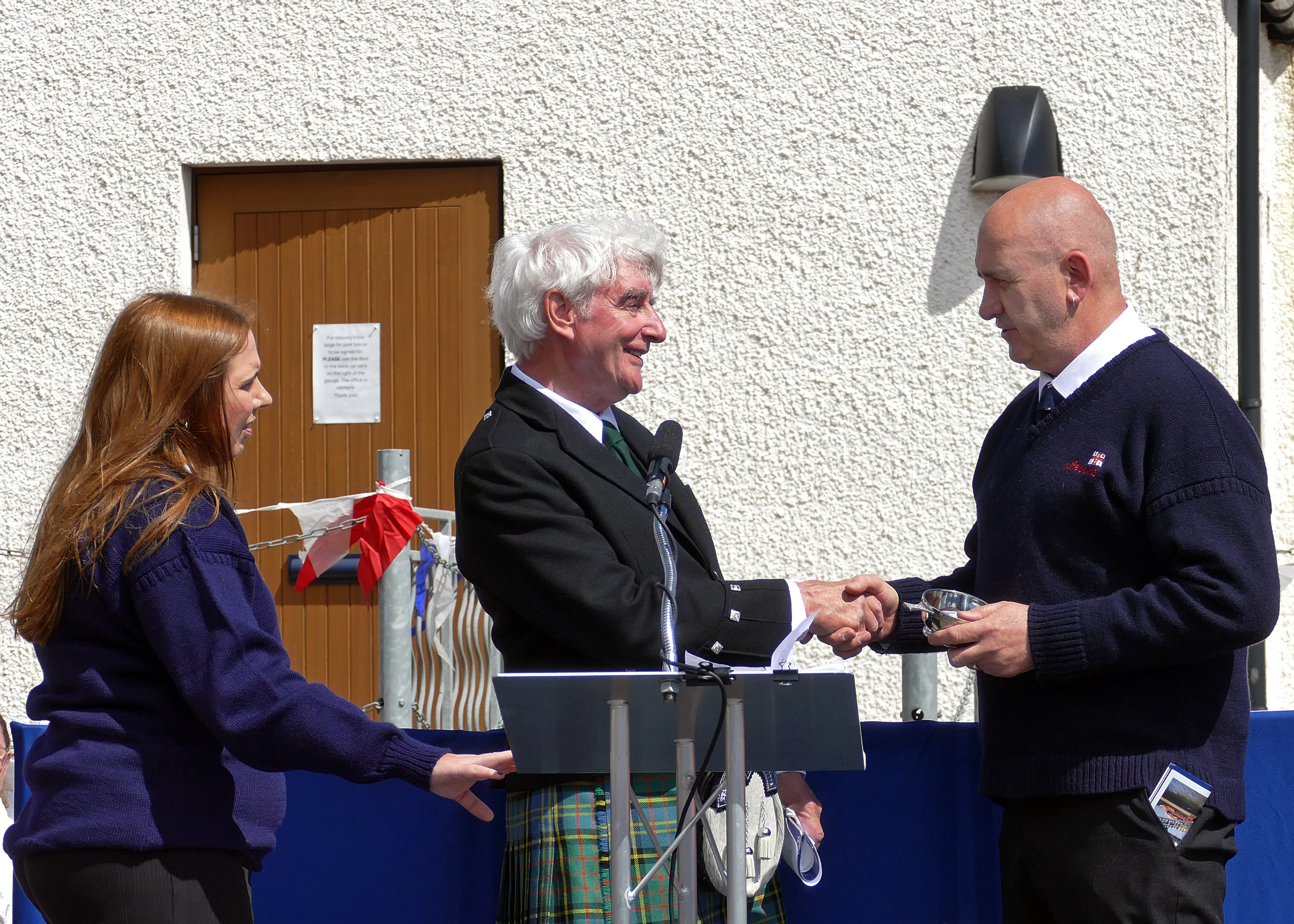 Scott Murray, Coxswain/Mechanic, presents quaich to Ken Brown