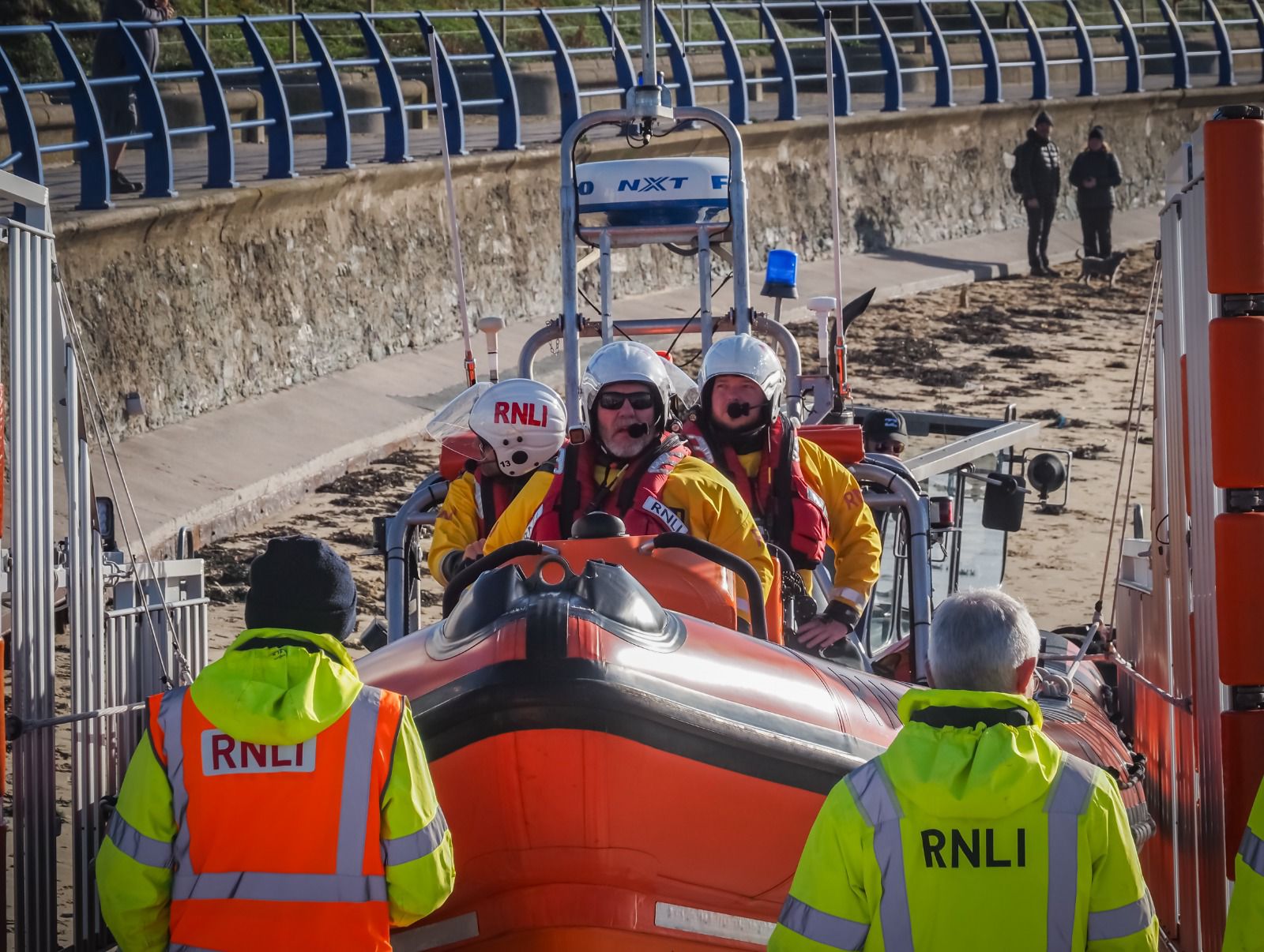 The lifeboat preparing to launch for training, with shore crew stood either side.