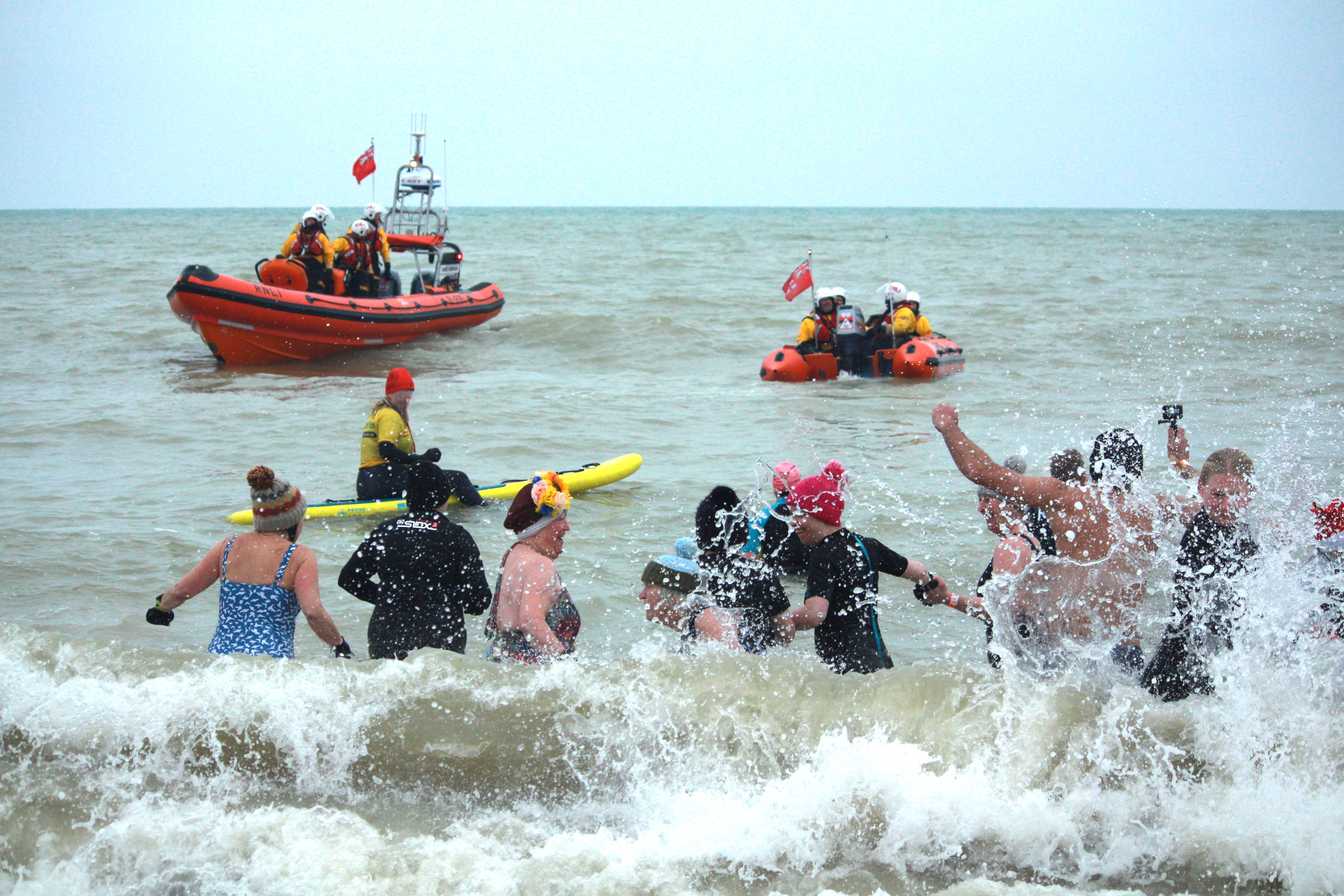 December Dip participants at the previous event with several participants seasonally dressed for the occasion.