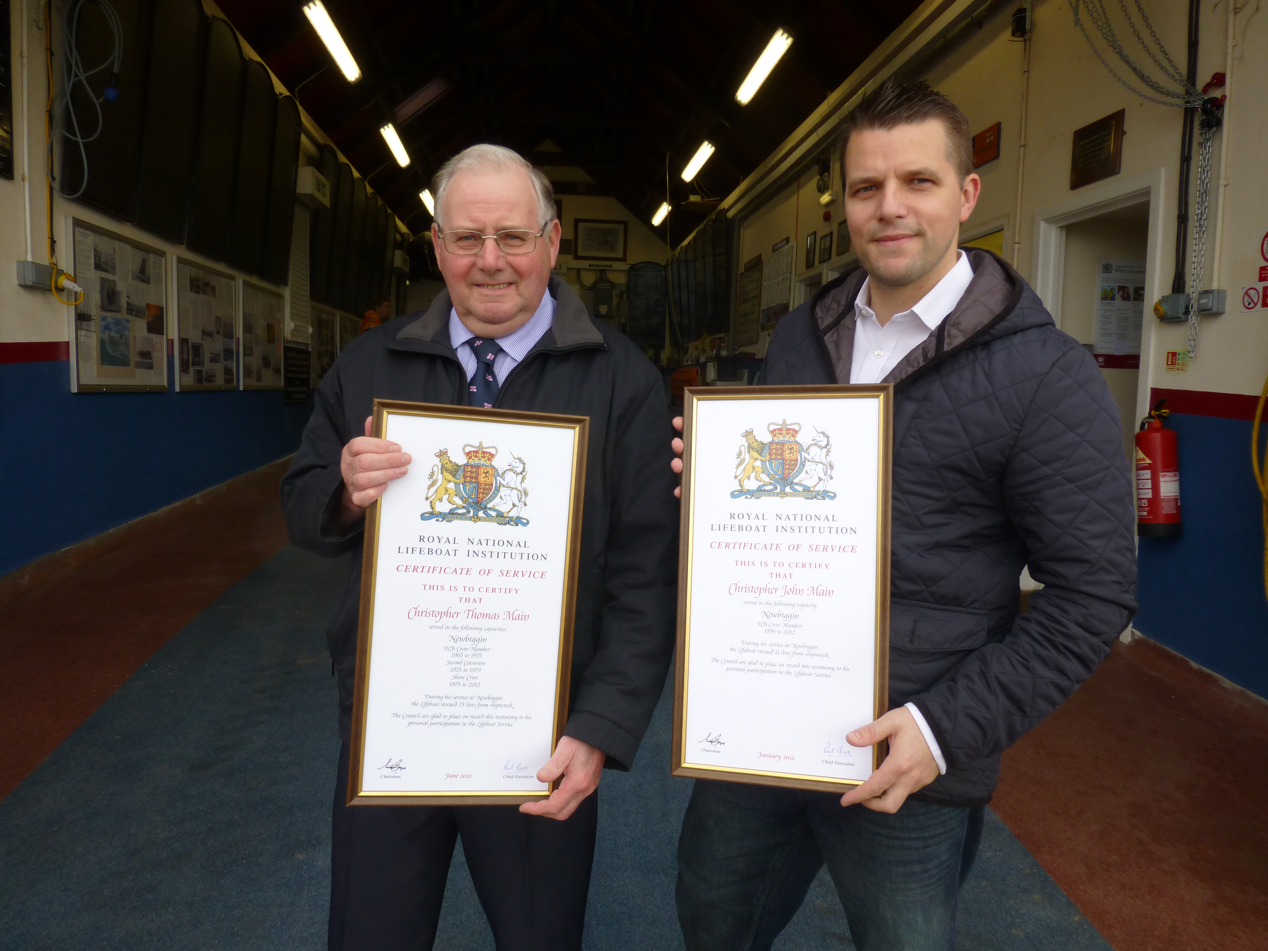 The late Chris main (left) and his son Christopher following a presentation