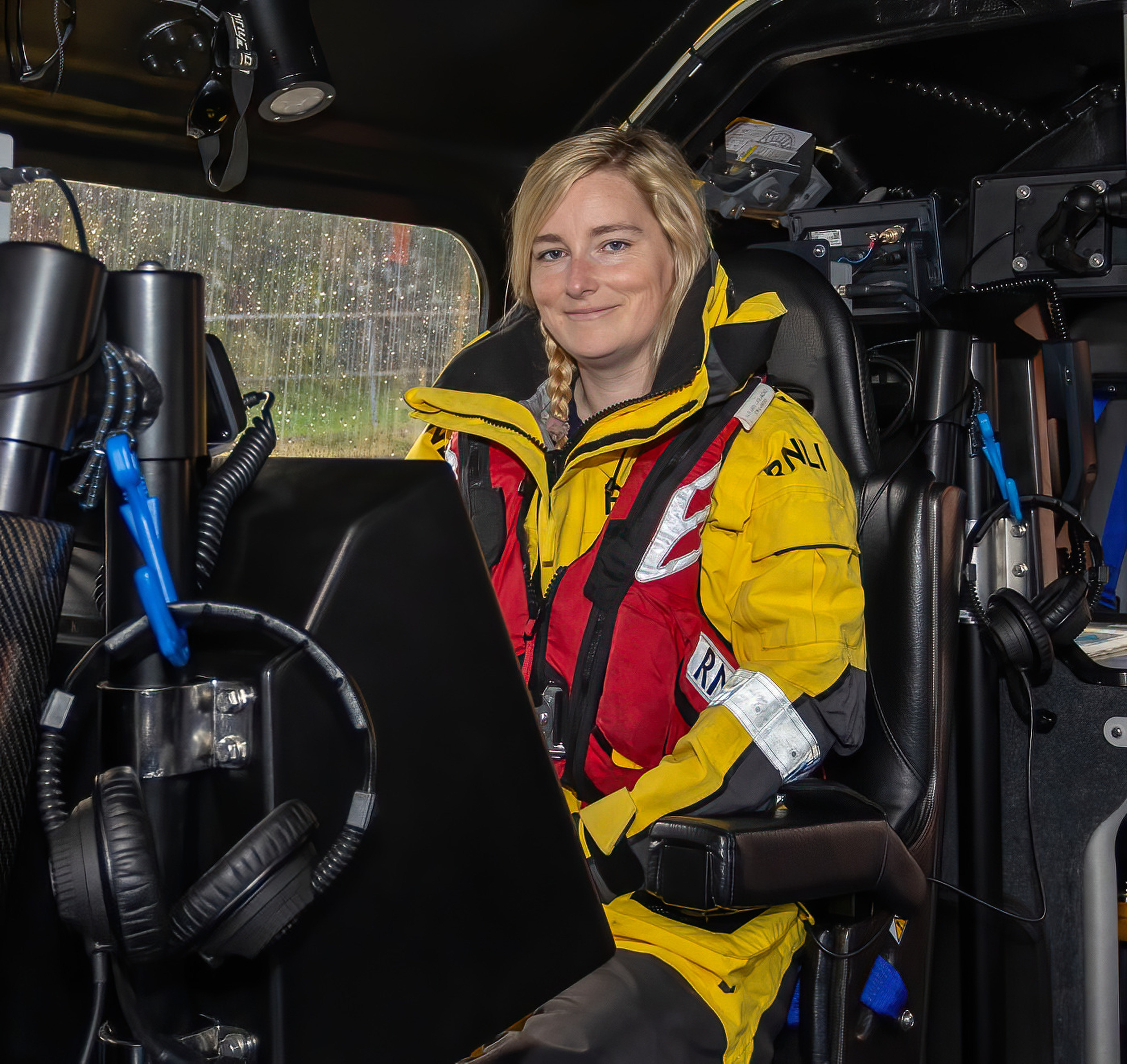 Leonie Woolf poses for a photo in the coxswain's seat of Oban lifeboat