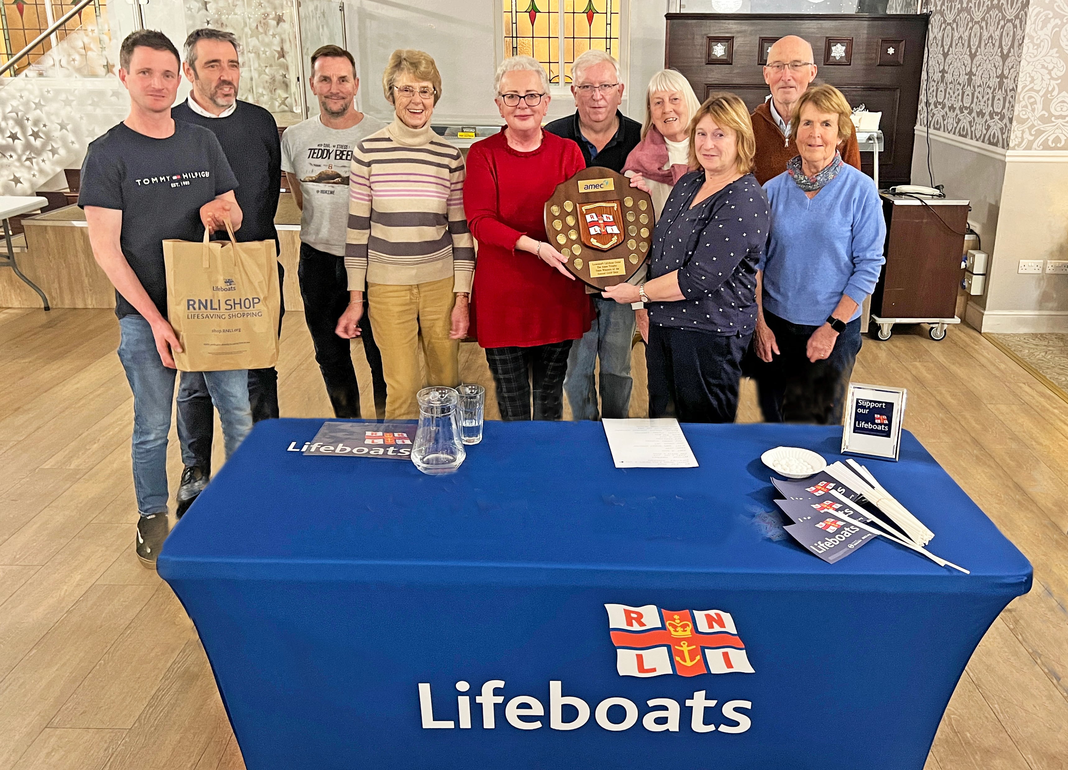 Some of Lowestoft RNLI Lifeboat Crew with the winning quiz team