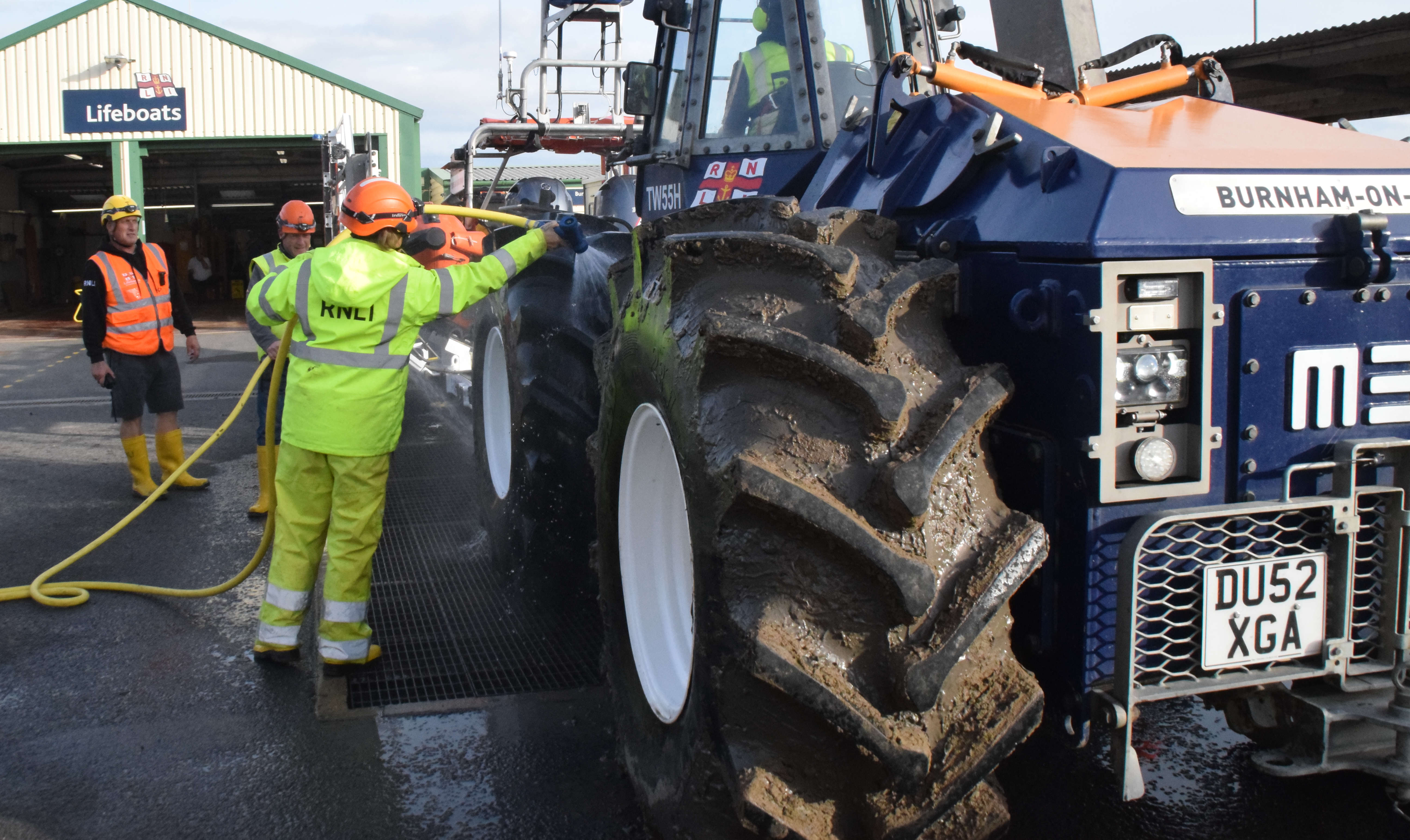 Launching equipment undergoing a very muddy wash-down