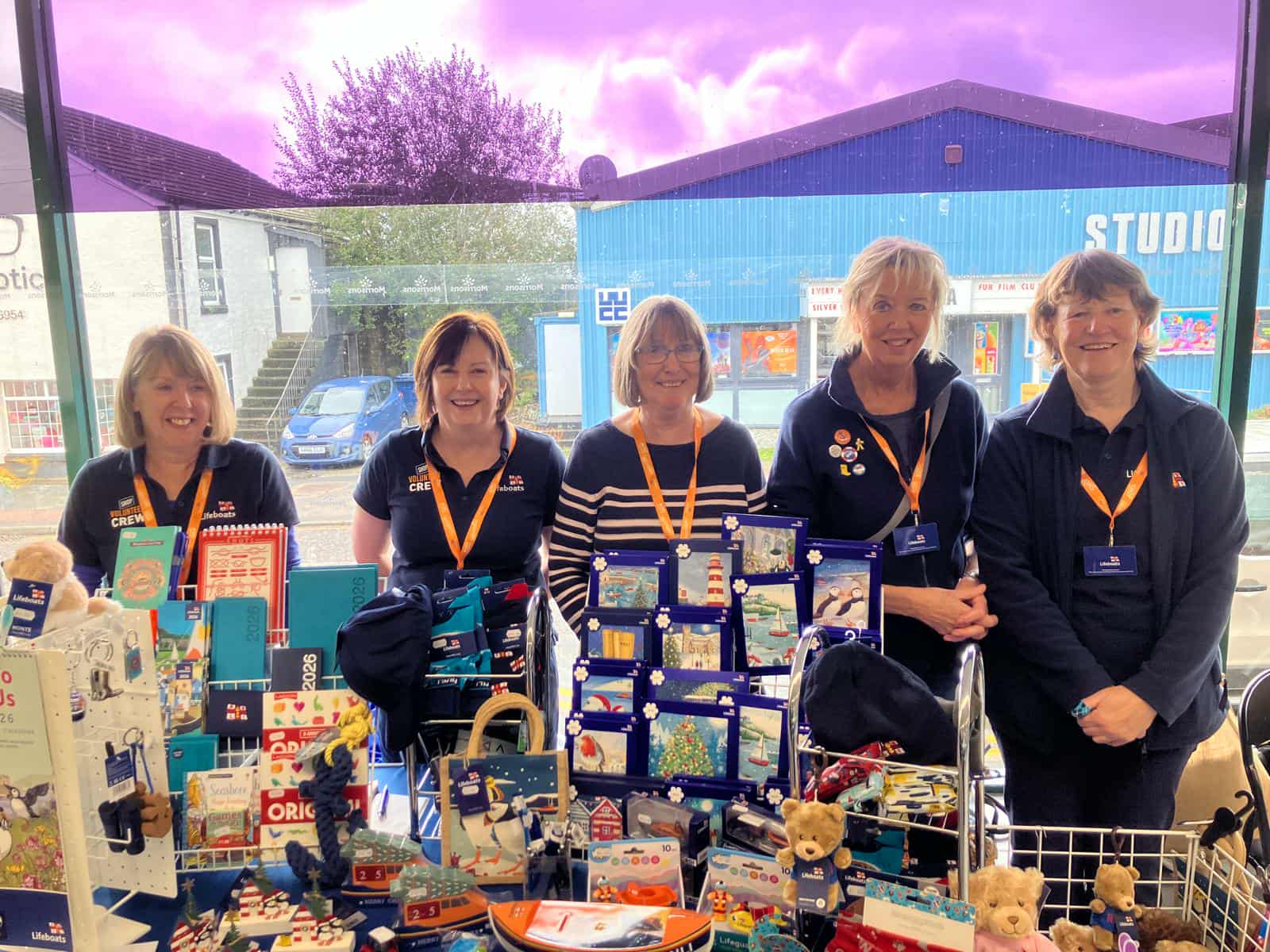 Fundrasiers with the pop-up shop set up with RNLI merchandise