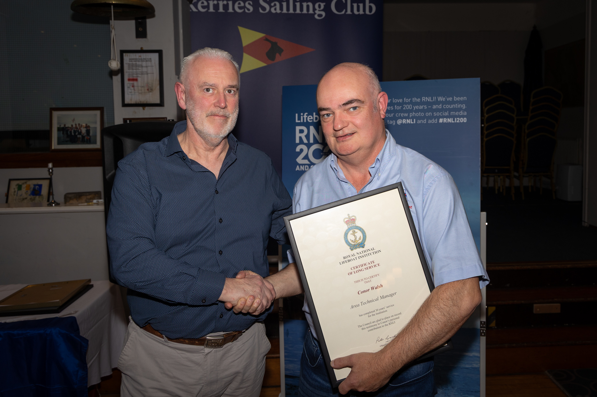 Michael O’Neill presenting Conor Walsh with his certificate of long service.