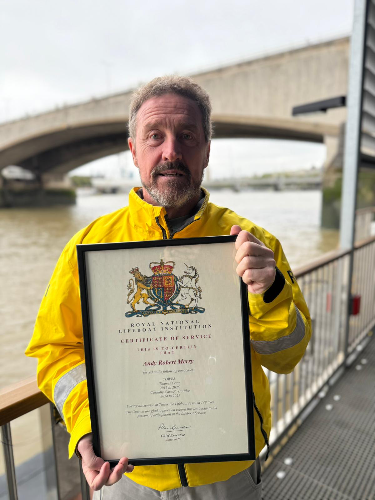 Andy holding his certificate of service which was presented to him by Station Manager Kevin Maynard.