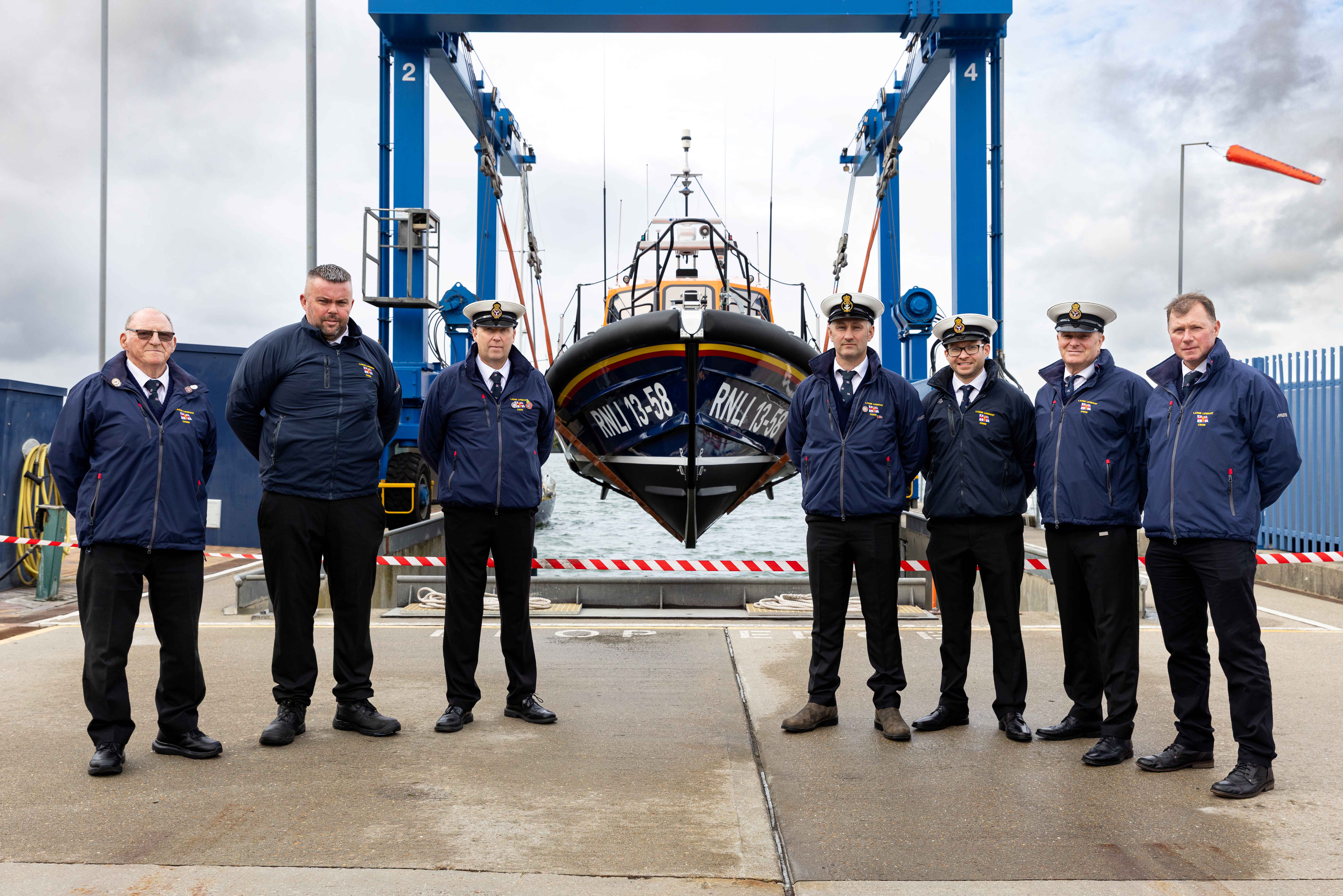 Larne RNLI crew members pictured alongside their new Shannon class lifeboat