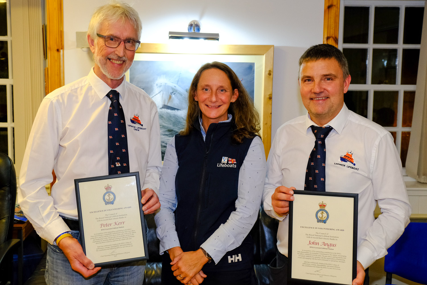 Peter Kerr (left) and John Angus (right) were presented with their 'Excellence in Volunteering' Awards by Jill Hepburn, RNLI Head of Region - Scotland, at Lerwick Lifeboat Station last night.