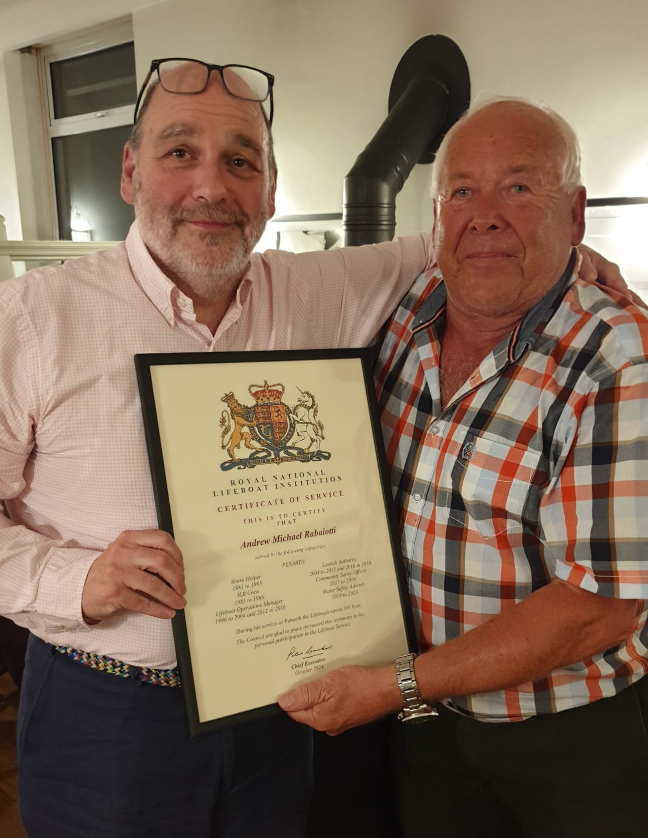 Andrew Rabaiotti receiving appreciation of service award from Gareth Wigmore
