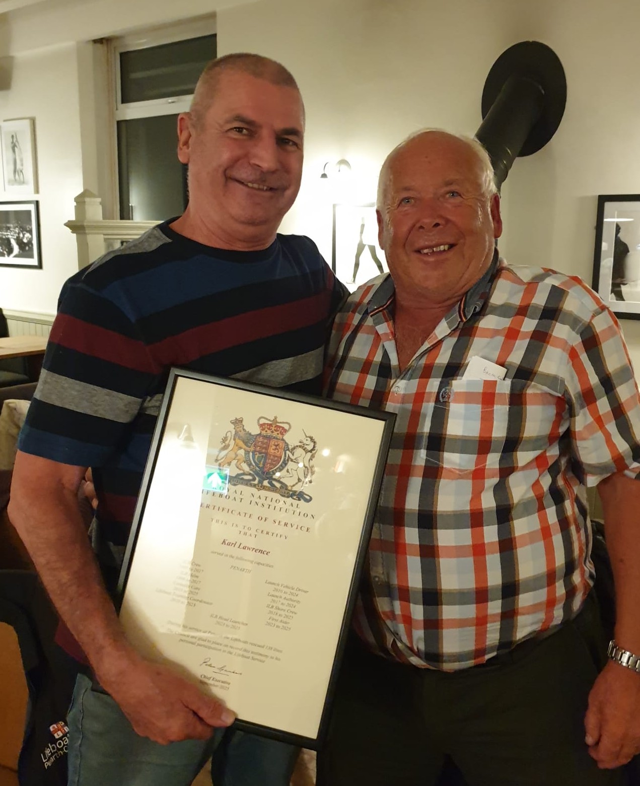 Karl Lawrence receiving long service award from Gareth Wigmore