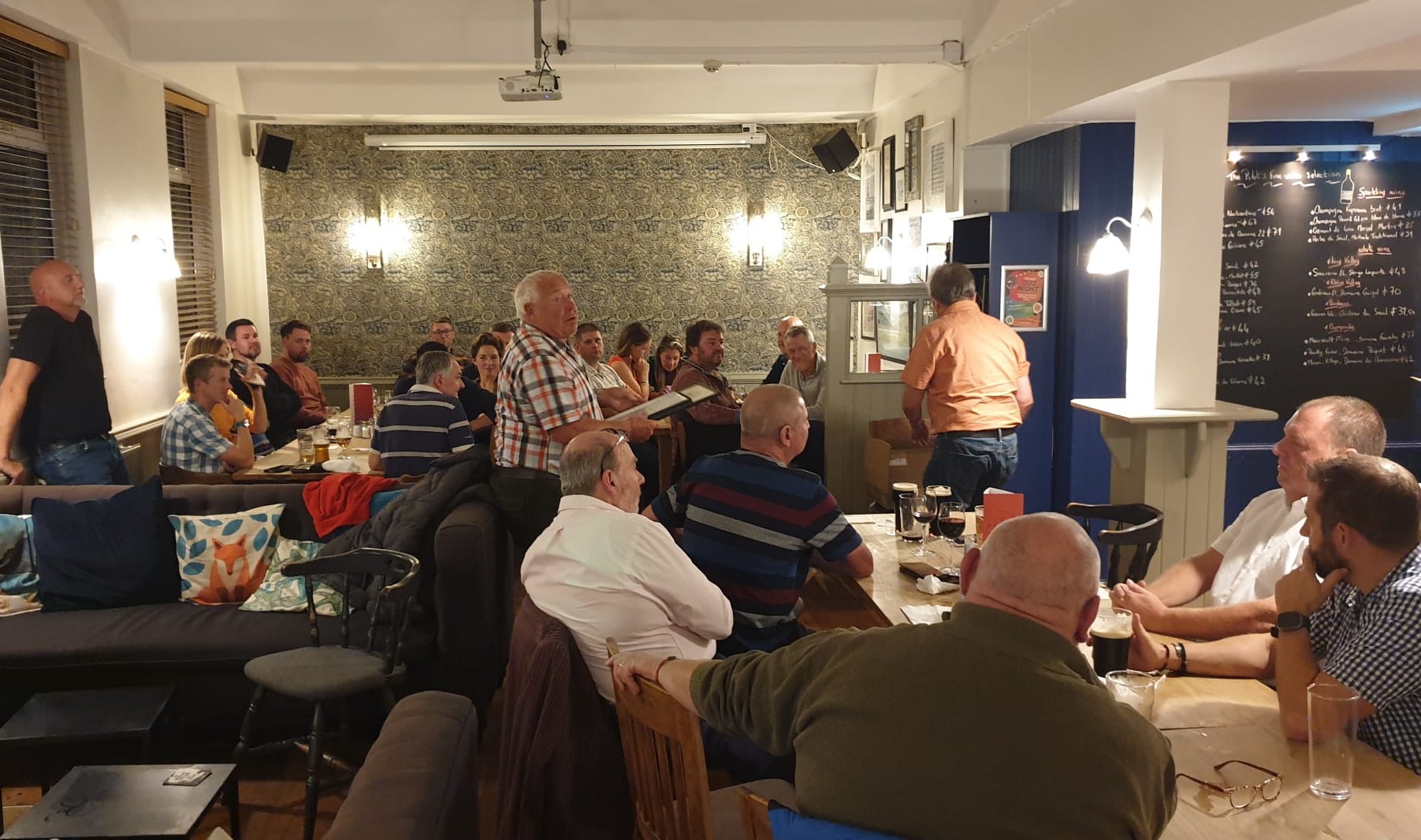 Long view of room capturing those who attended the awards night with Gareth Wigmore centre in mid speach.