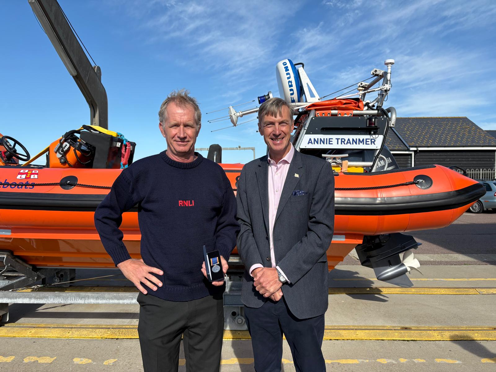 Jochem Voogt receives his 20 year service medal from RNLI Chief Executive, Peter Sparkes.