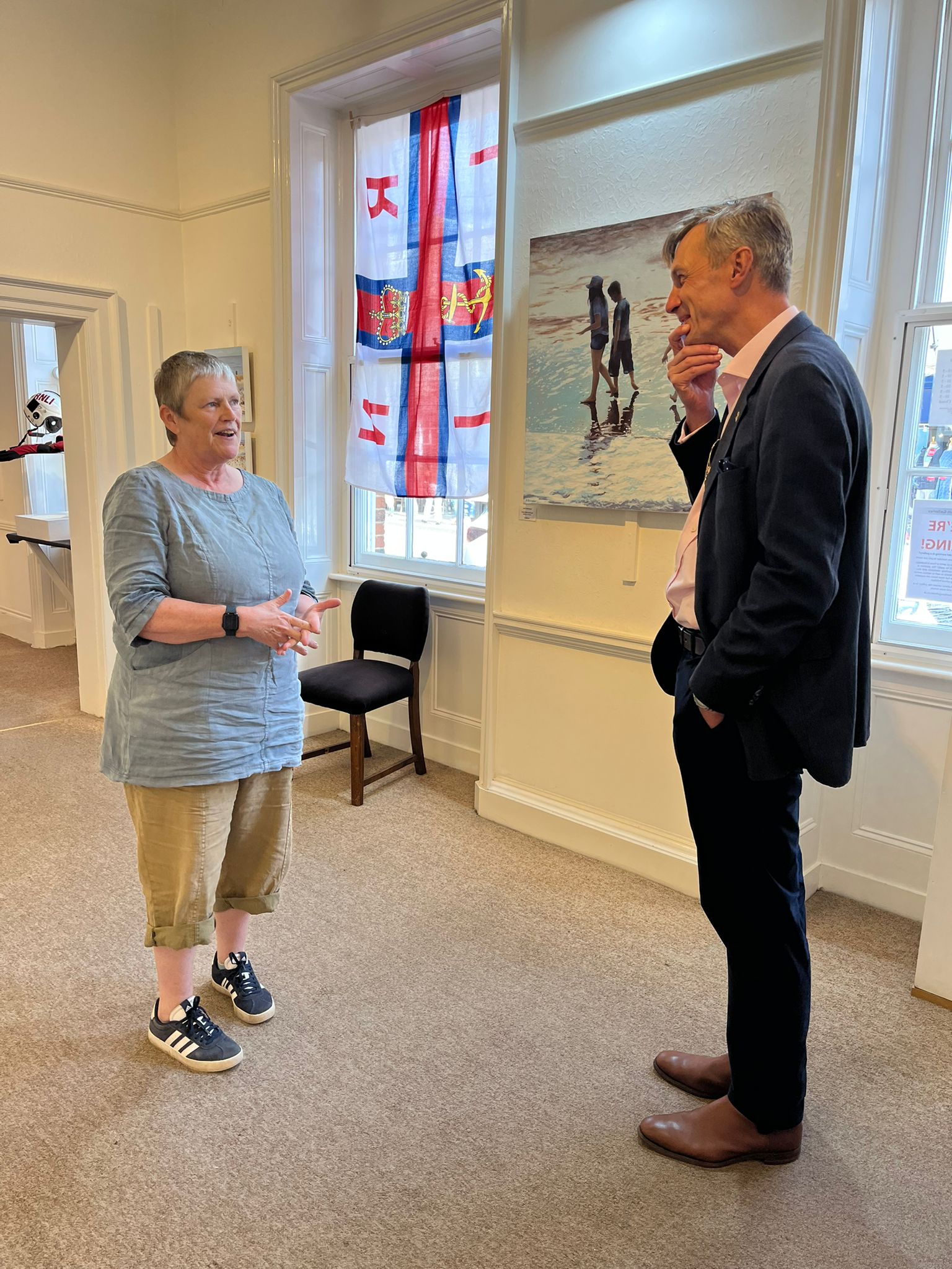 Peter Sparks chatting to local artist Kate Batchelor at the opening of the Sole Bay Exhibition at Buckenham Gallery, Southwold