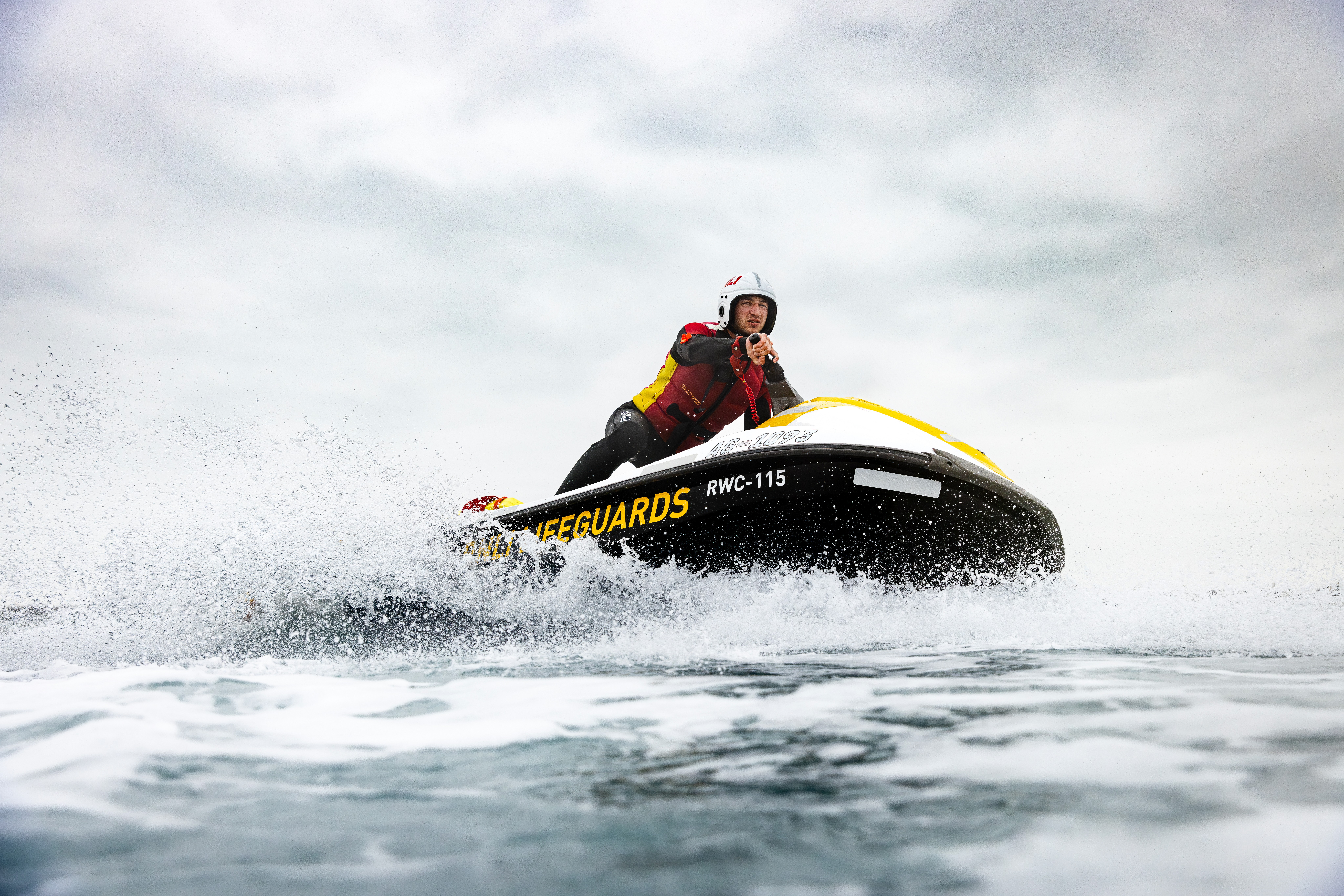 RNLI Lifeguard Supervisor on a jetski out at sea.