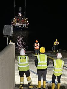 Newcastle RNLI's shore crew watch their all-weather lifeboat at the slip