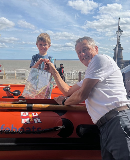 William Sanders being presented with her prize by Phil Lay Penarth LOM whilst sat on the D-Class in front of the station