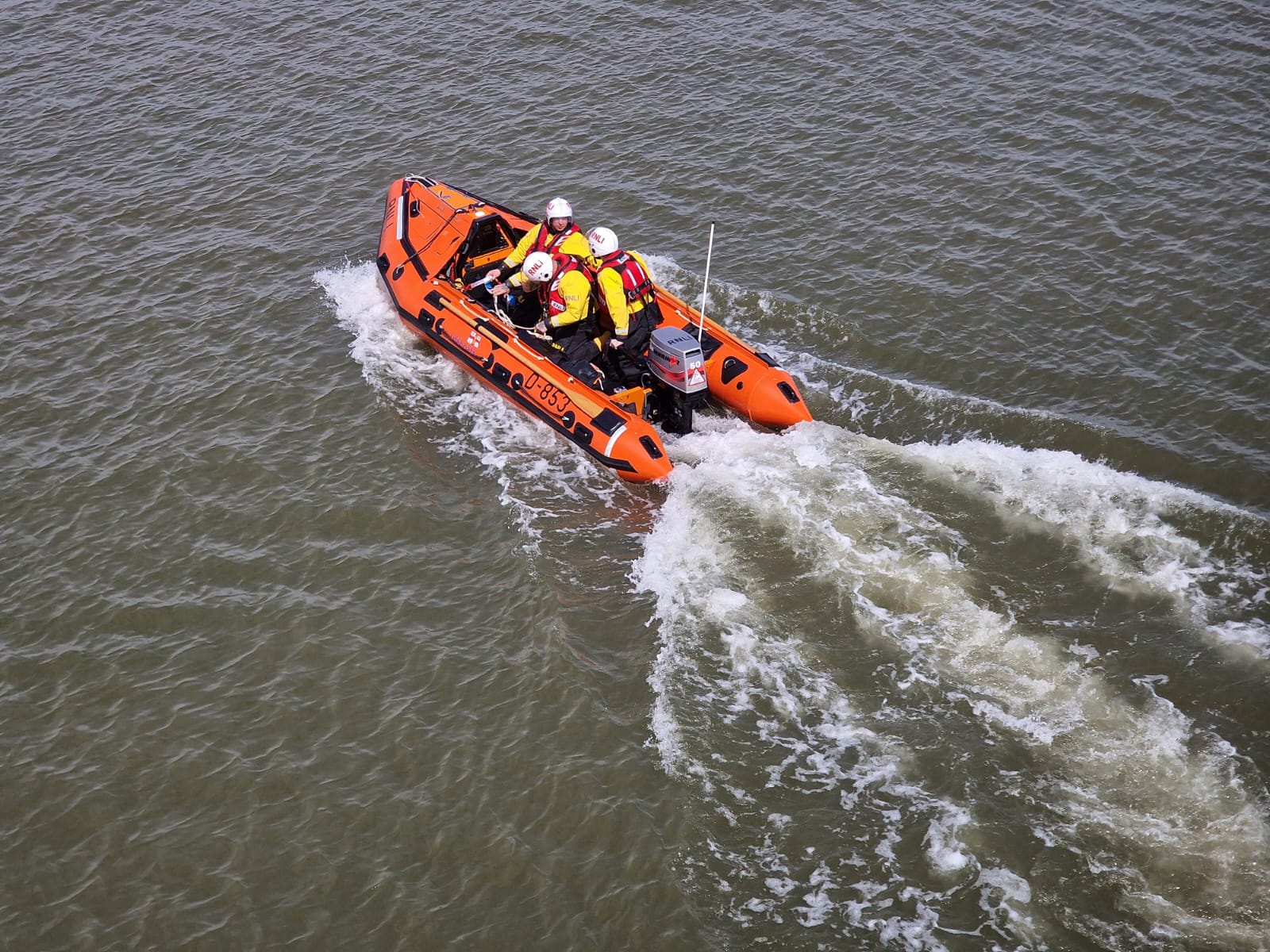 A D class inshore lifeboat with wake behind, taken from above