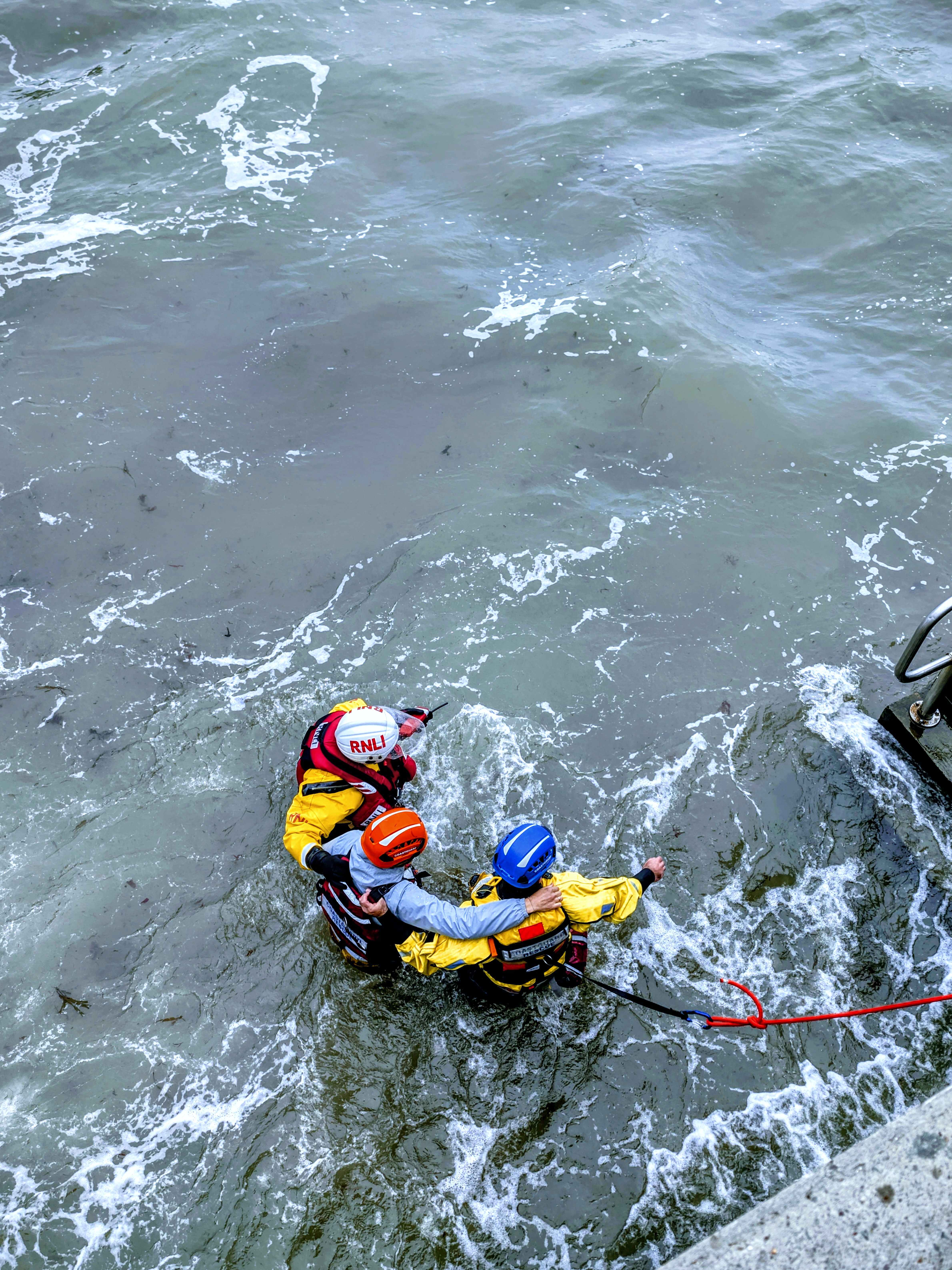 Lifeboat Crew and Coastguard support casualty