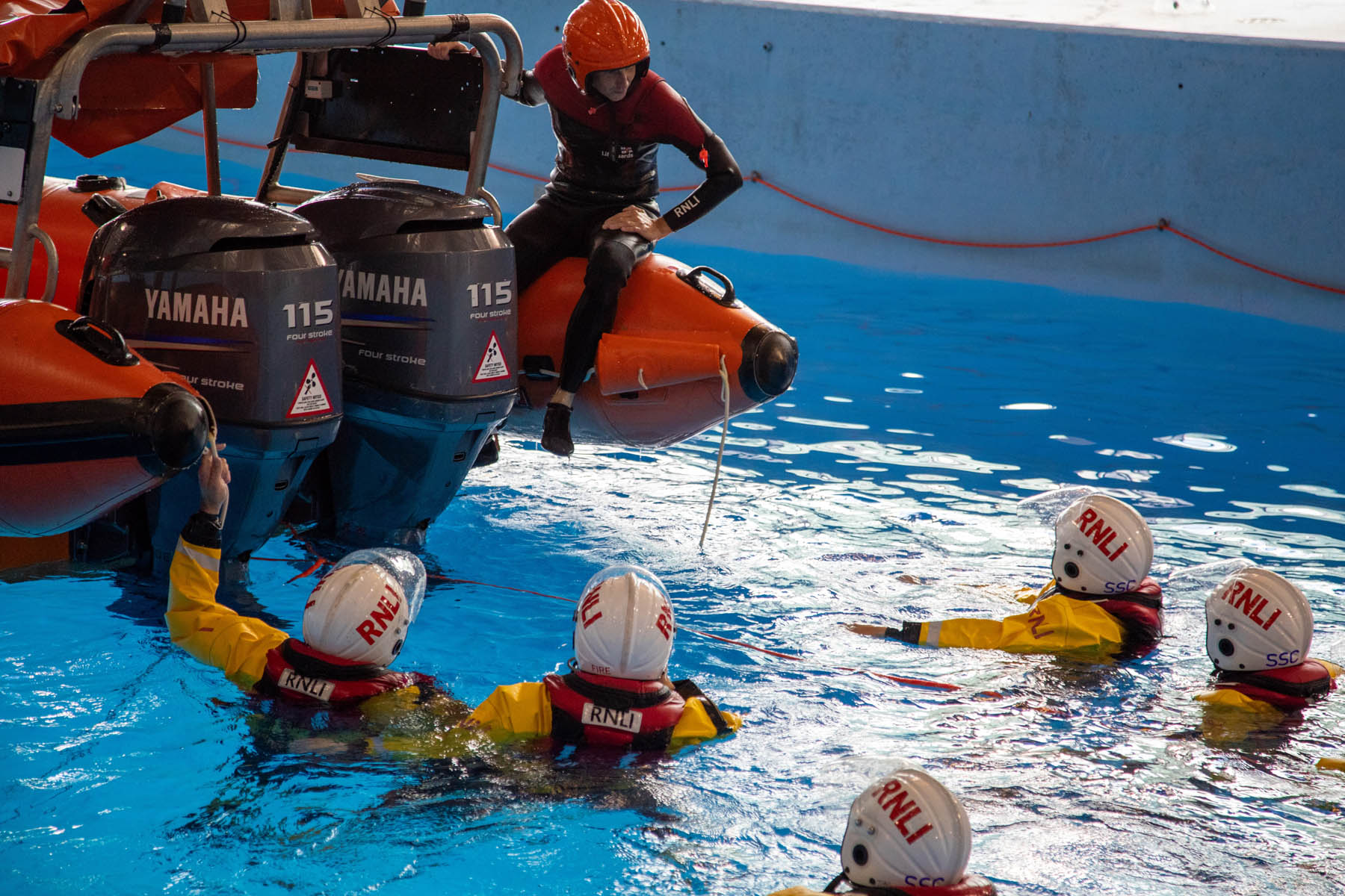 Undergoing training in the college pool.