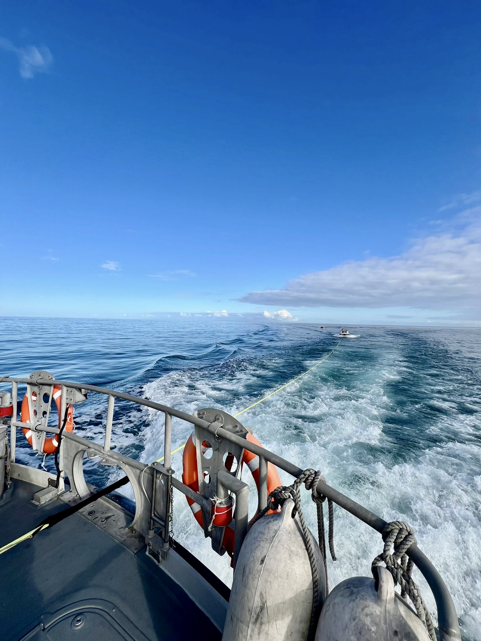 All-weather lifeboat towing casualties back to safety of Ballylumford Harbour