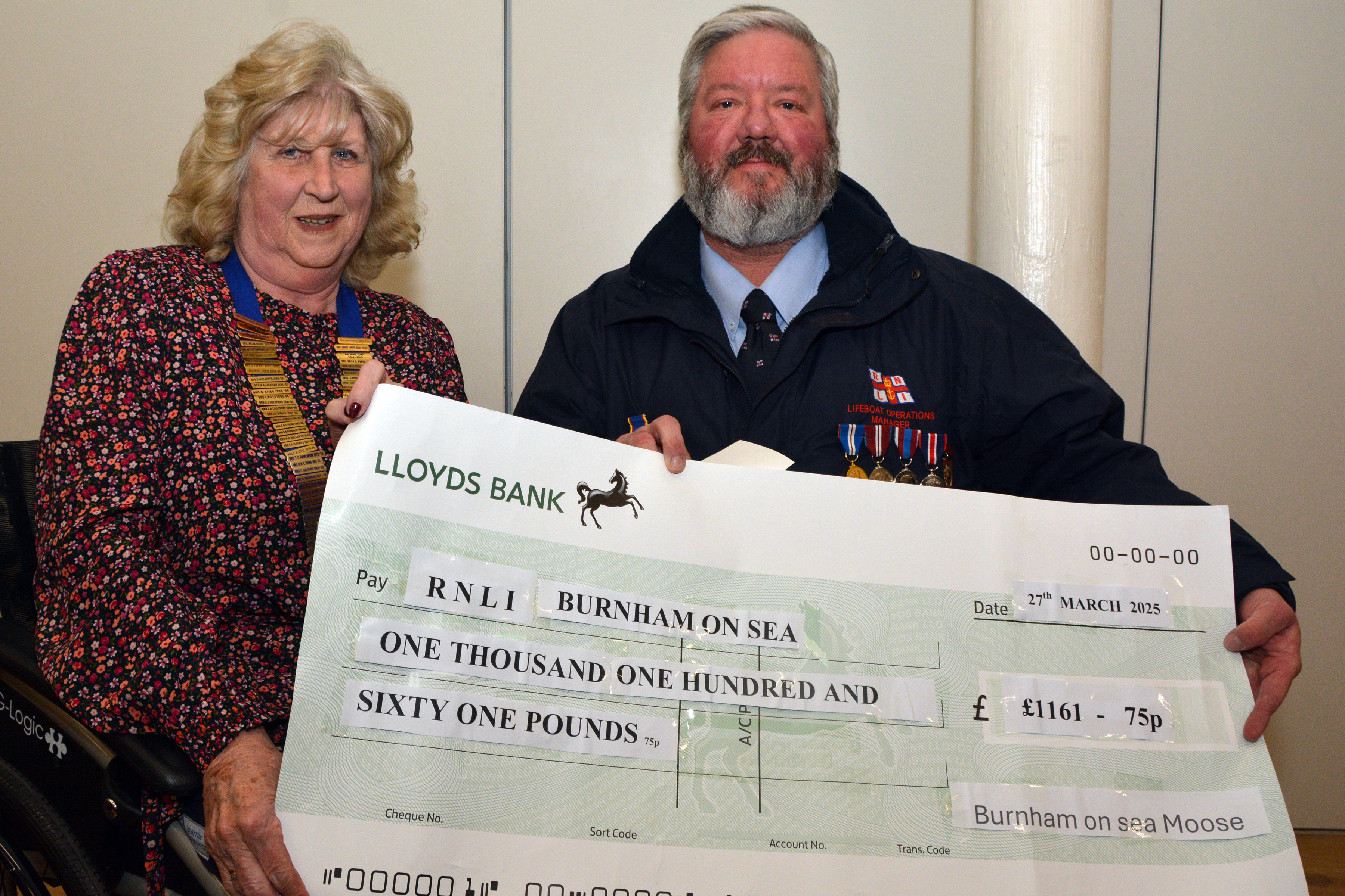 Matt receives a donation from Burnham Moose President Rita Harris