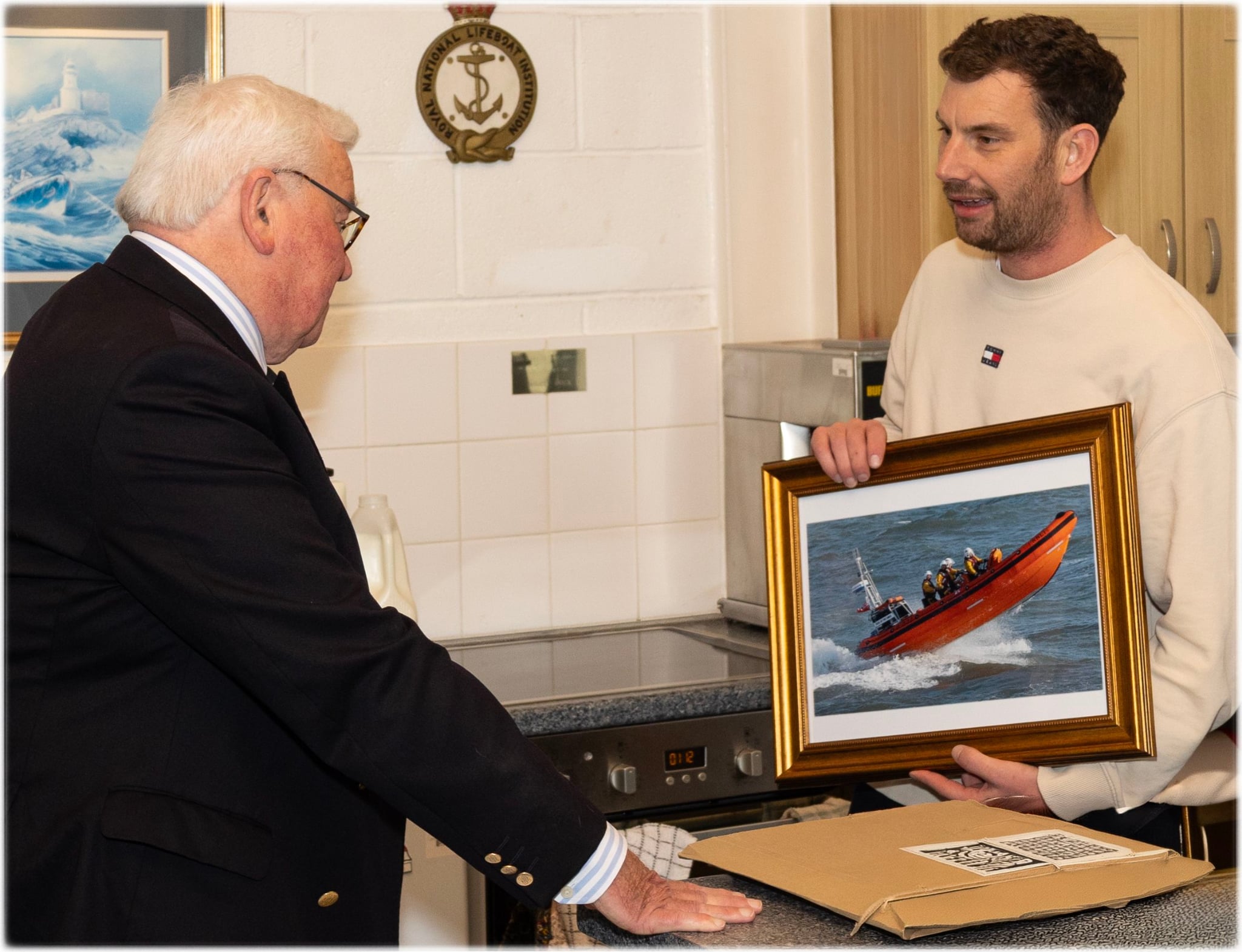 Chris Missen presented Peter with a framed picture of Porthcawl RNLI's Atlantic 85 lifeboat