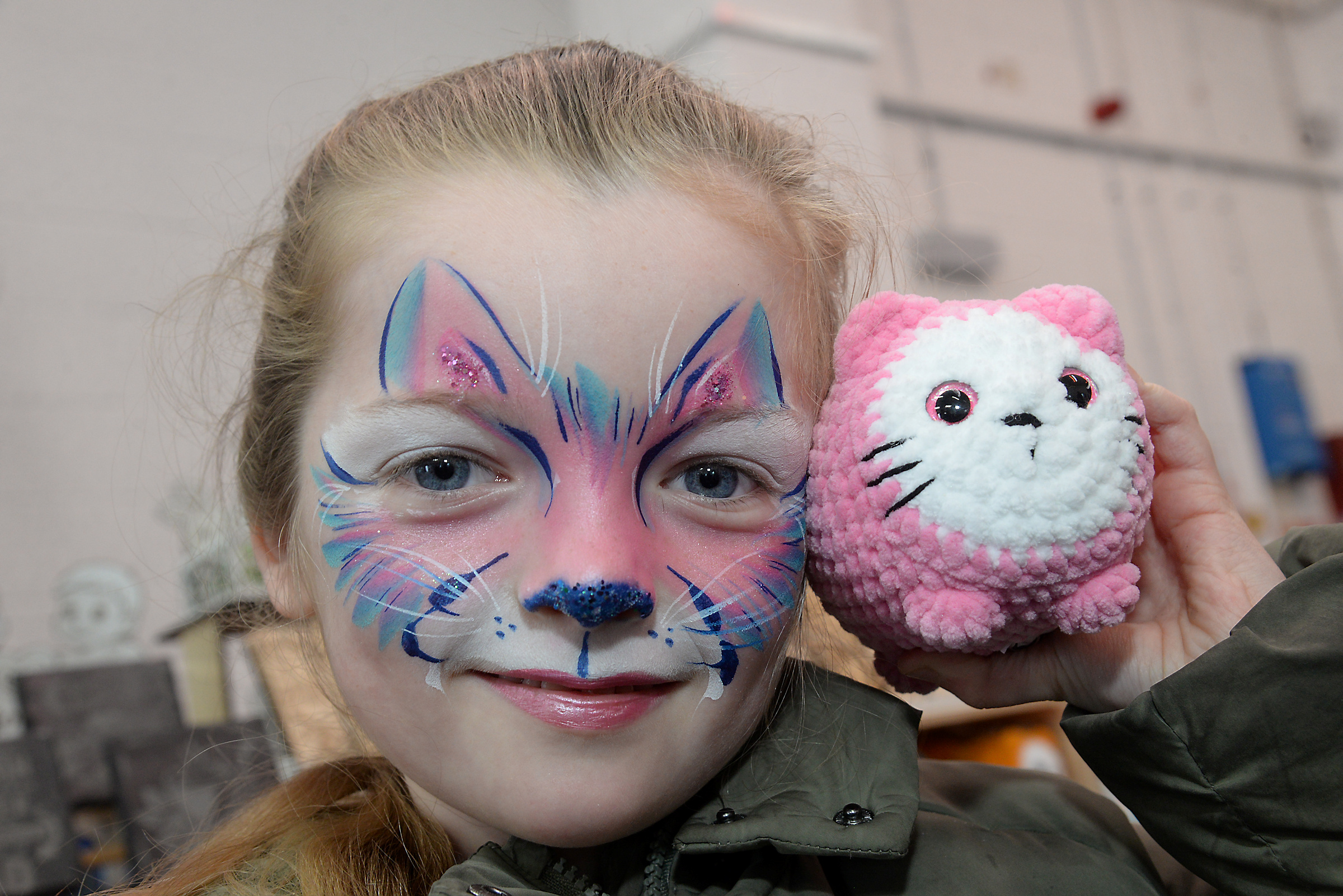 Phoebe, six and her painted face and soft toy at the Whitstable RNLI Easter Fair on Good Friday.