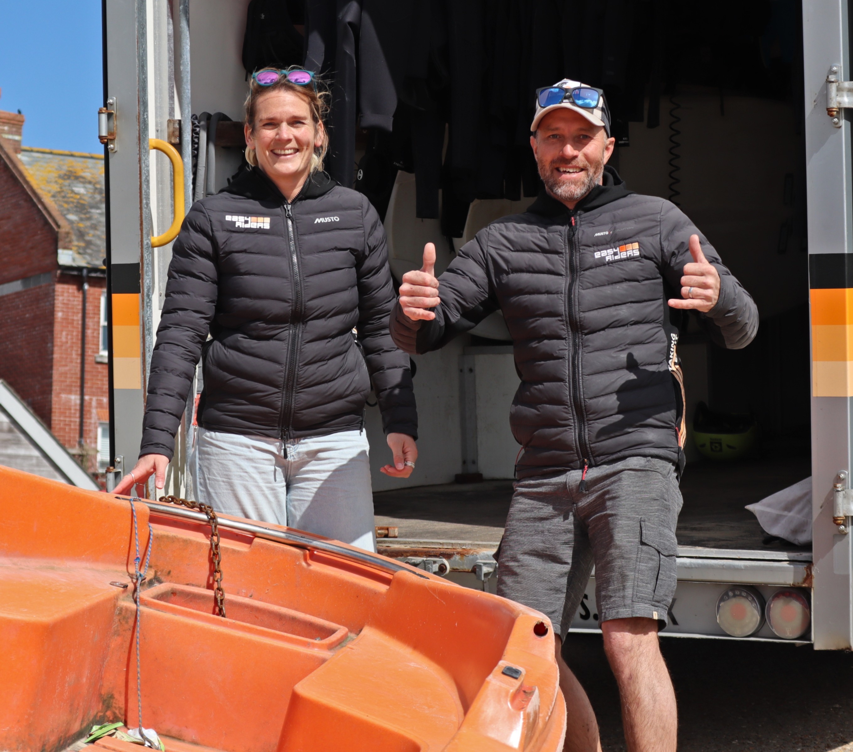Gemma Soloman and Andy Gratwick from Easy Riders give a thumbs up to HM Coastguard and the RNLI for working together to return Izzy, the orange tender, back to her home base.