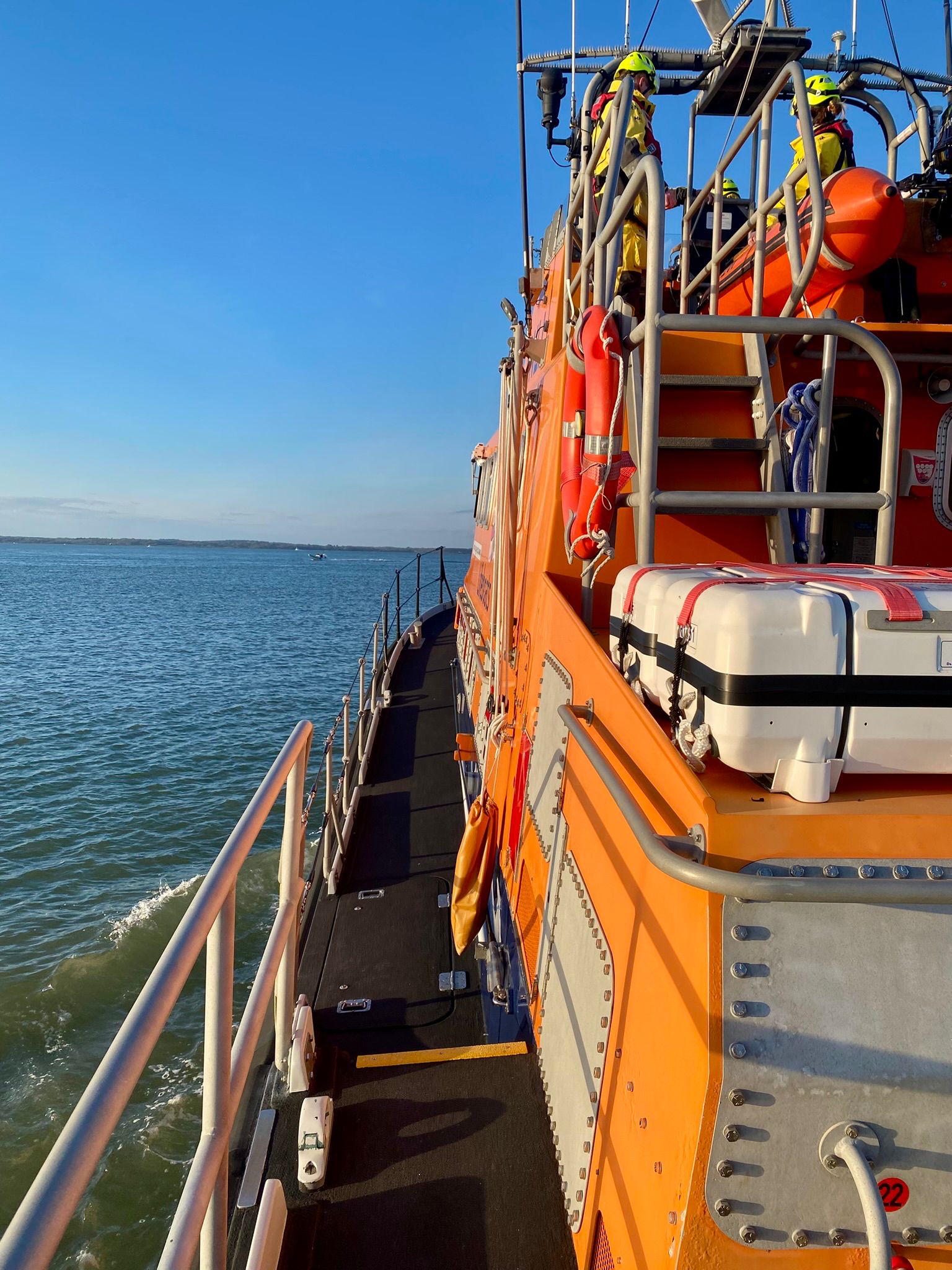 Side view of Yarmouth lifeboat with blue skies and flat sea 