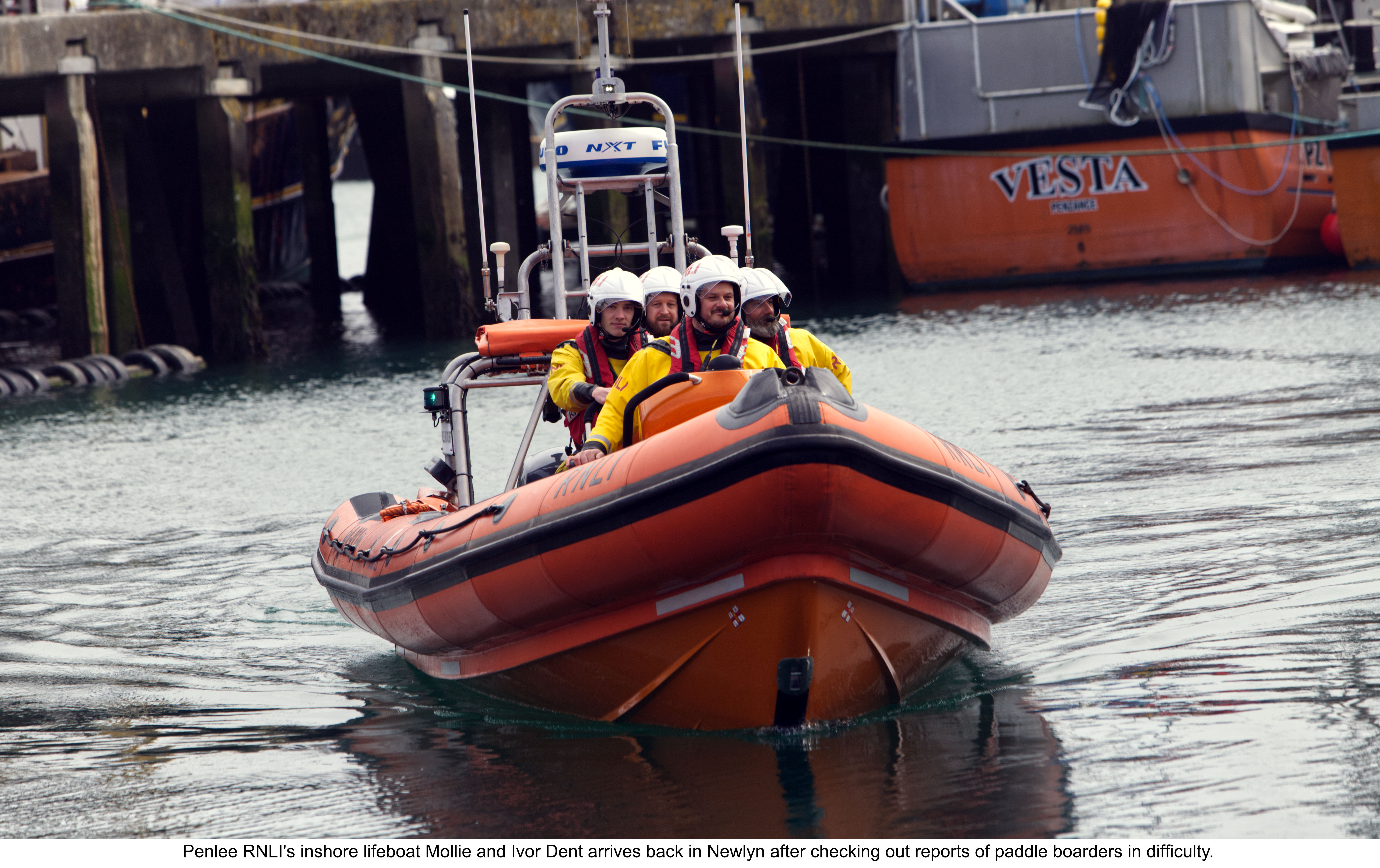 Picture shows an inshore lifeboat with crew.