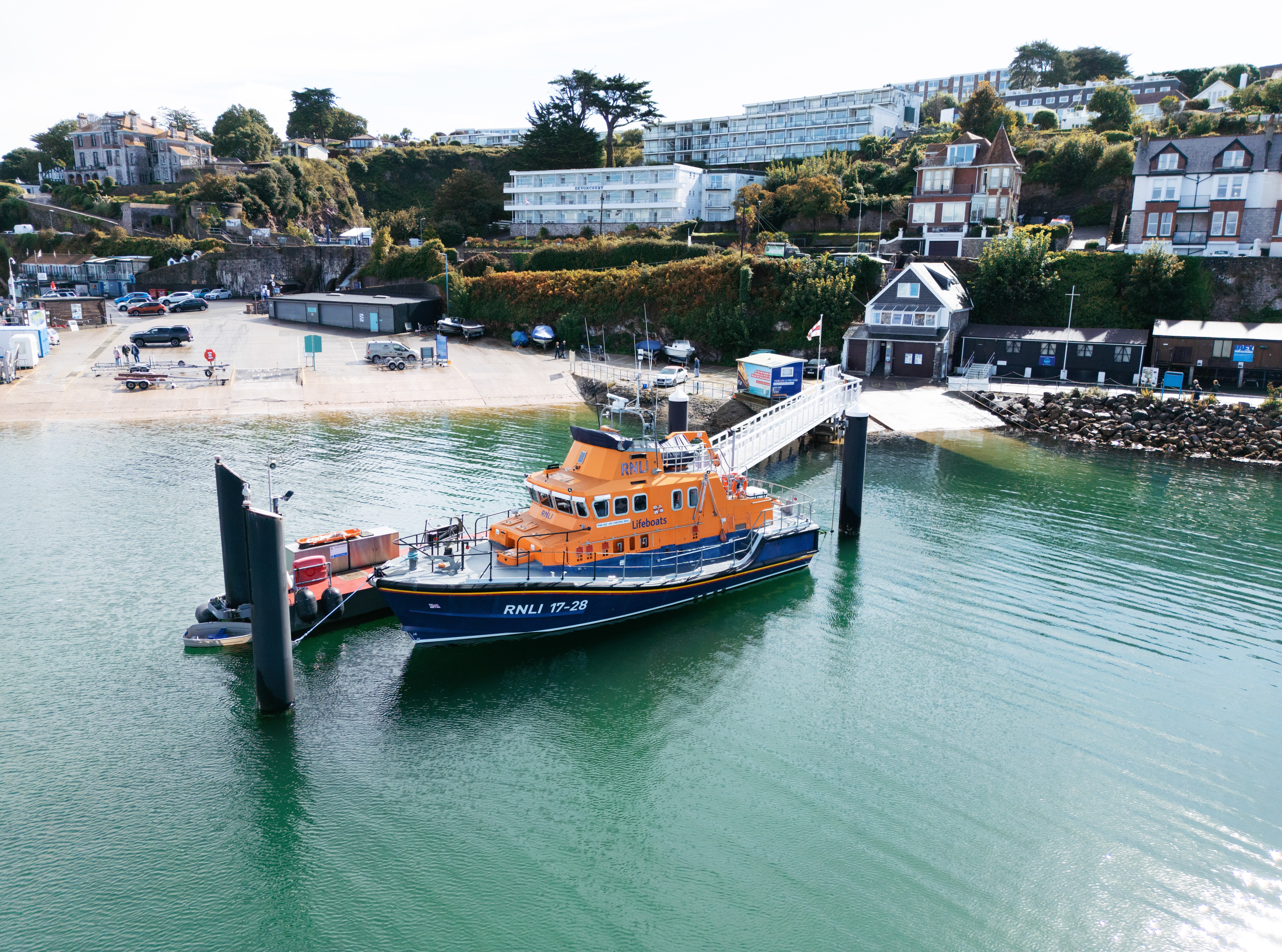 Bird's-eye view of Torbay Lifeboat Station, Brixham harbour with Severn-class All-Weather lifeboat on moorings