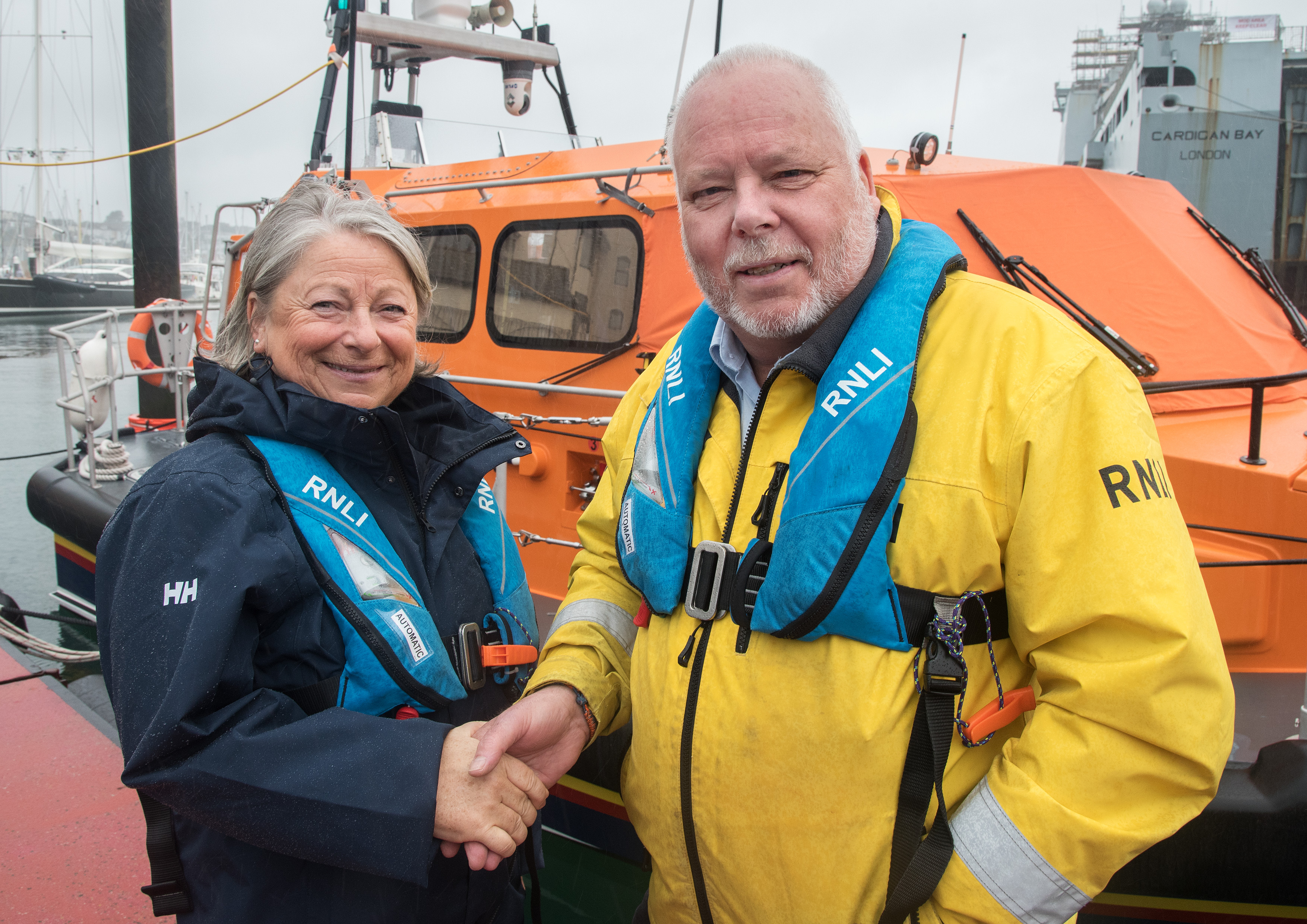 Yvonne being thanked by Falmouth RNLI Deputy Coxswain Dave Nicoll.