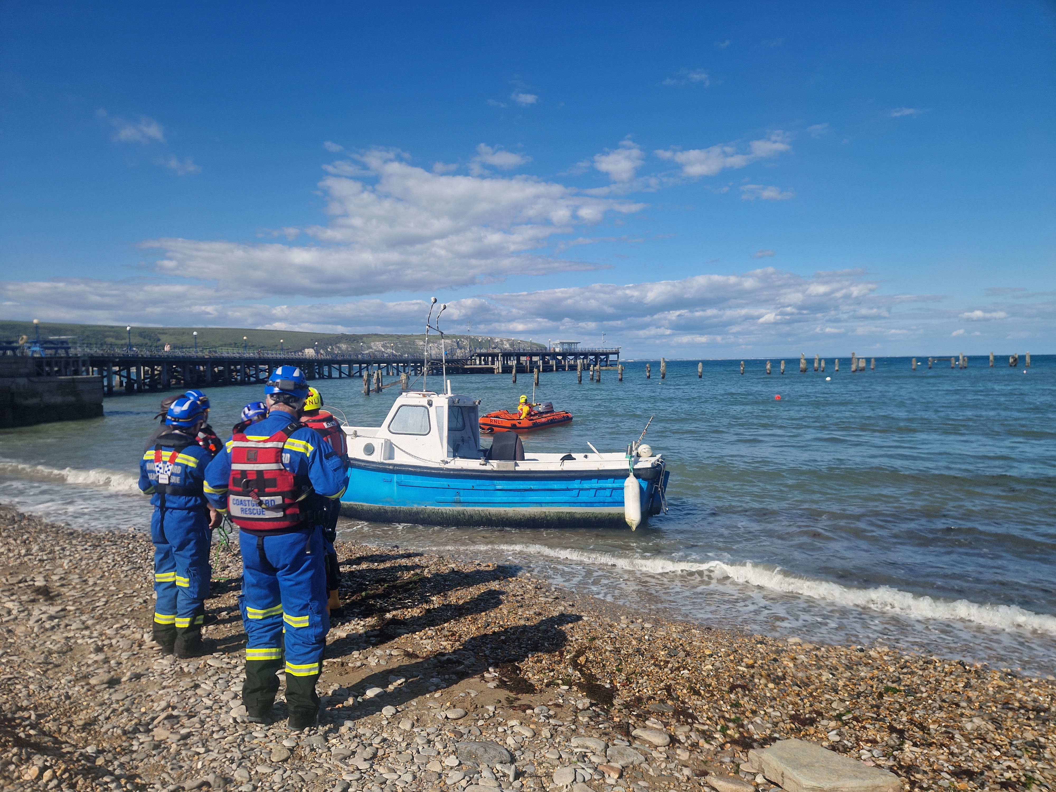 Swanage ILB on scene to fishing vessel washed ashore, with HM Coastguard in attendance.