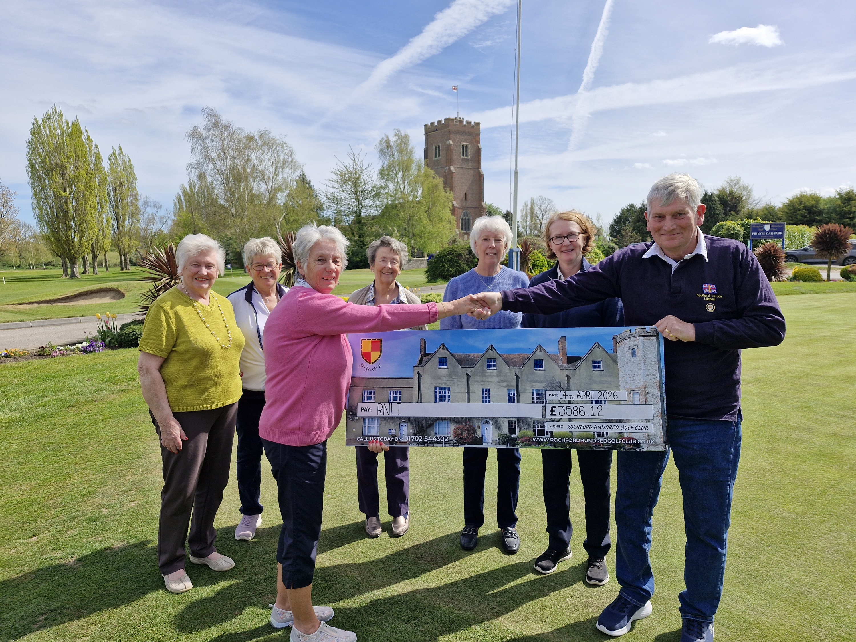 2025 captain Sue Proctor and some of the ladies presenting the funds to RNLI volunteer Tony Clarke