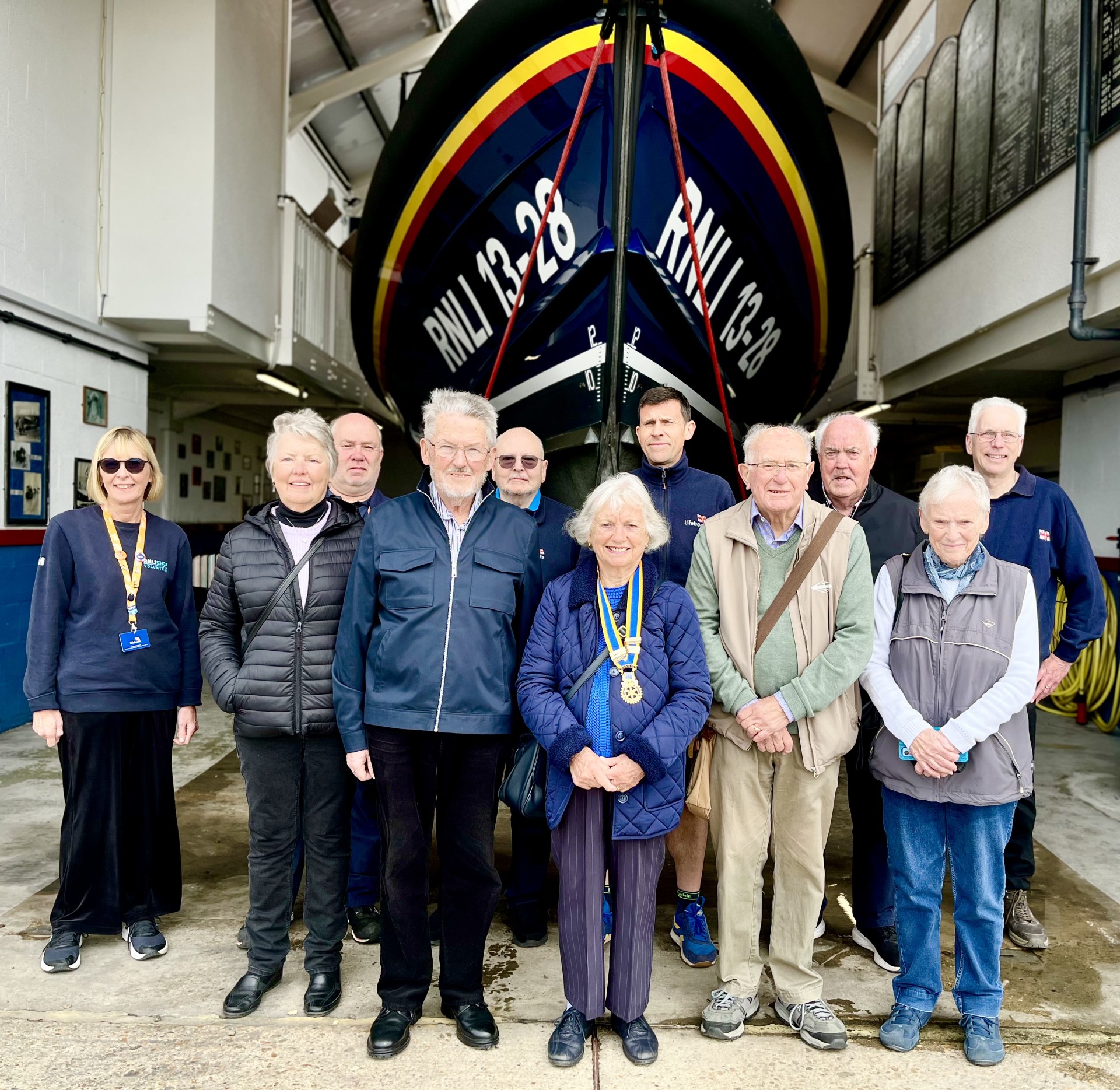 Rotary Club members standing in front of Hastings lifeboat