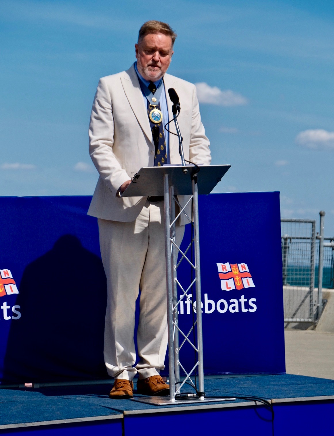 High Sherriff on the podium addressing the invitees 