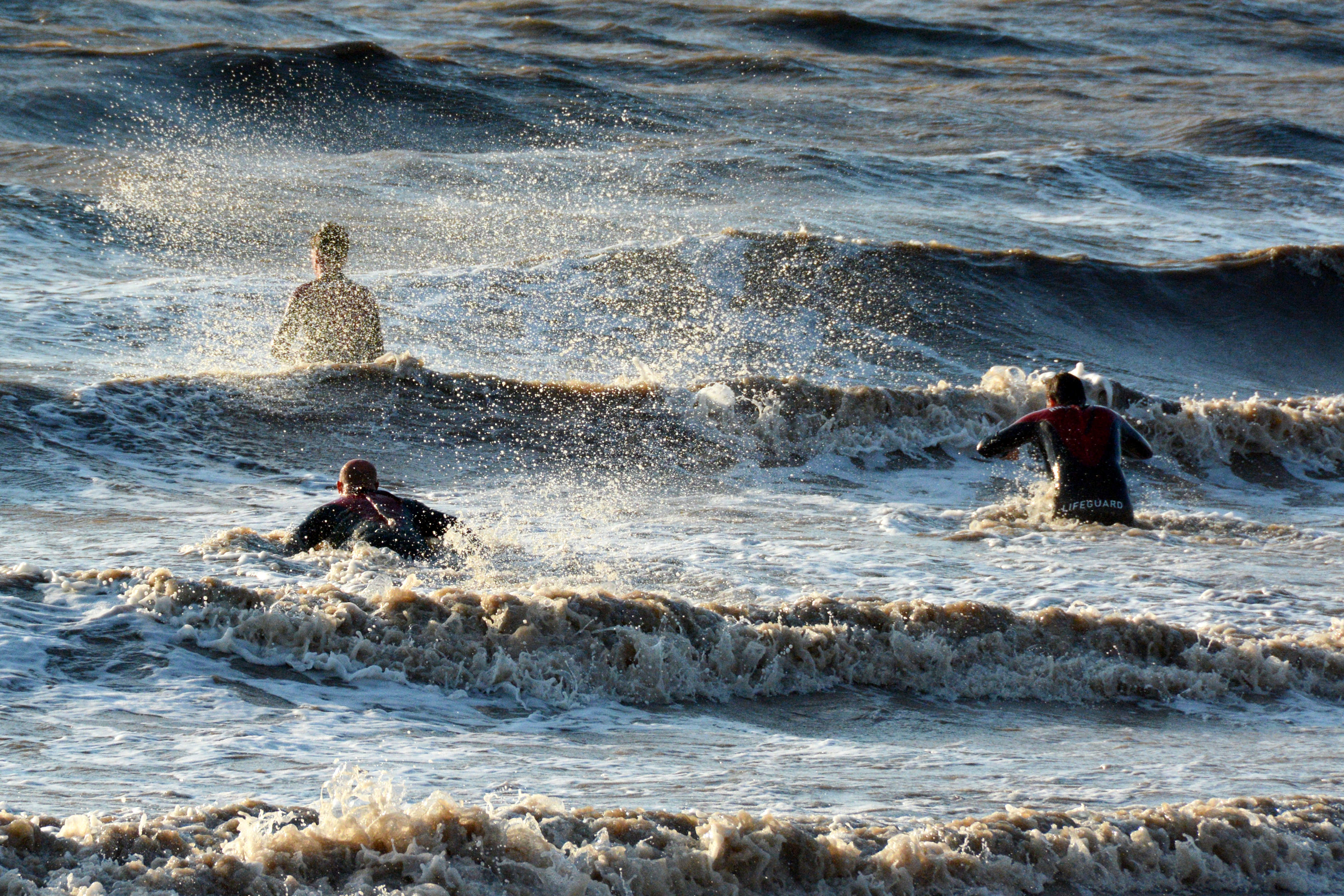 Lifeguards enter the sea