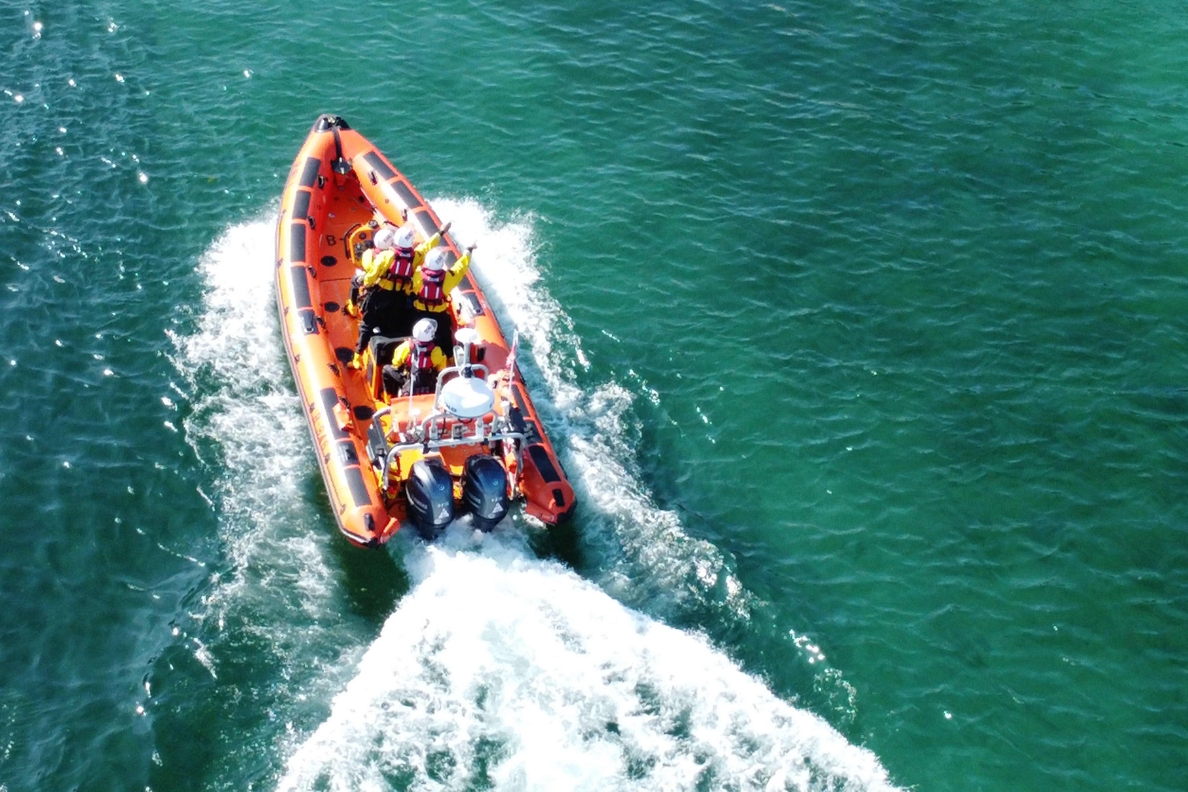 Crew on the Atlantic 85, B-946, Spirit of Cooperation locating the exhausted swimmer