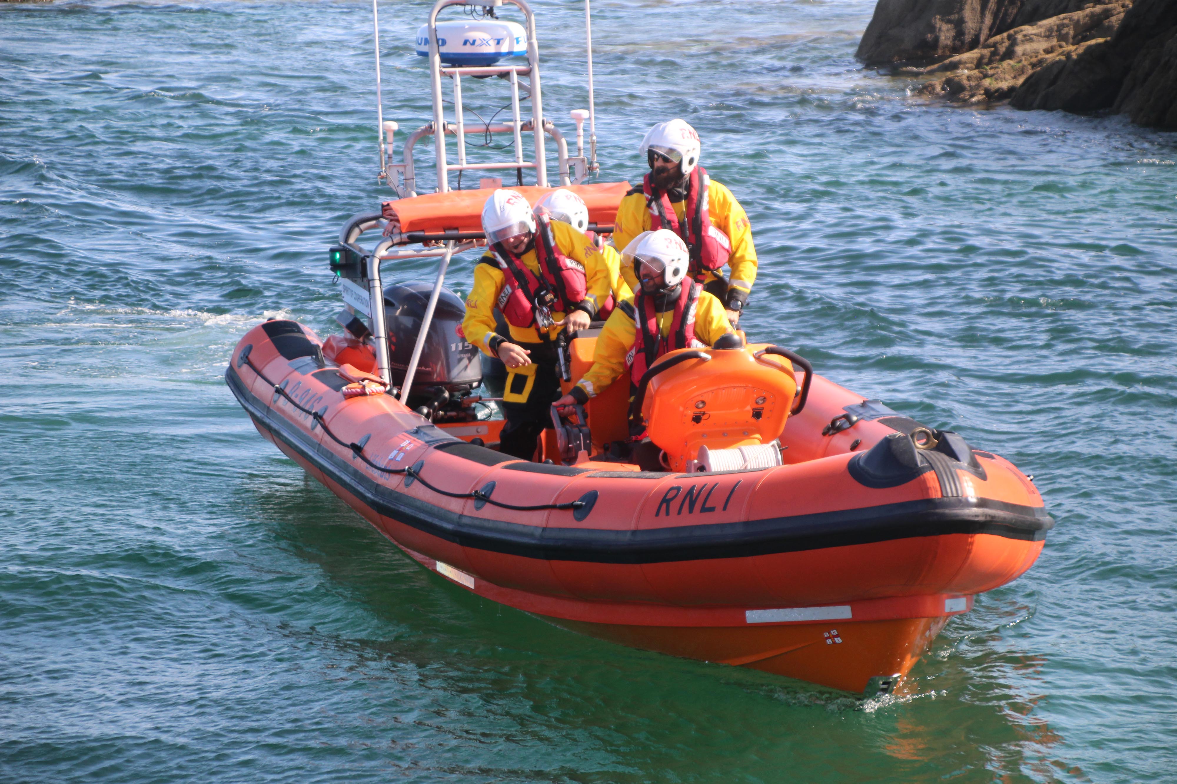 Crew on the Atlantic 85, B-946, Spirit of Cooperation locating the exhausted swimmer