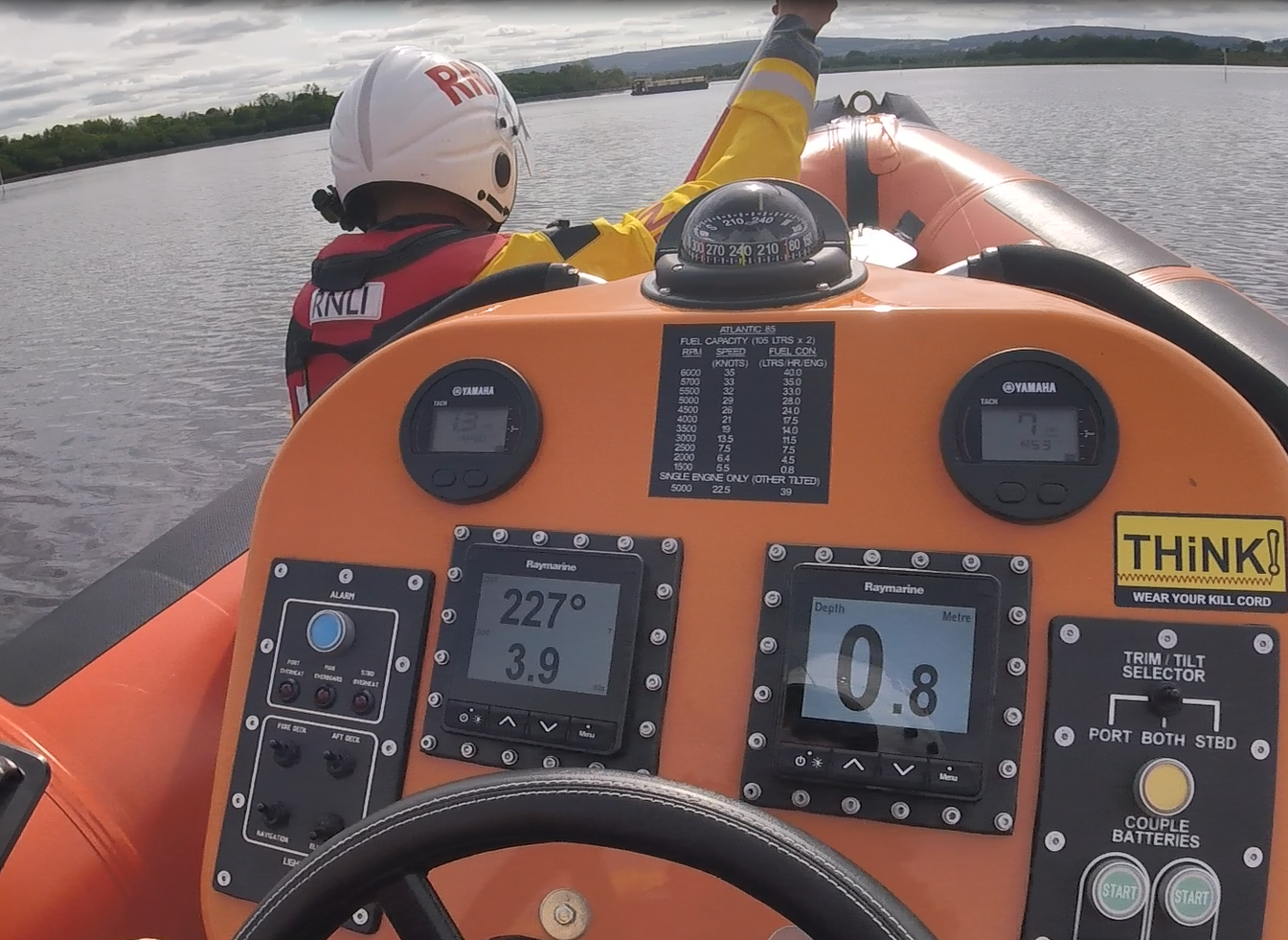Carrybridge Lifeboat arriving on scene at the casualty vessel which is aground. A crew member is kneeling at the front of the lifeboat ready to use the dipstick to depth the water into the casualty vessel.