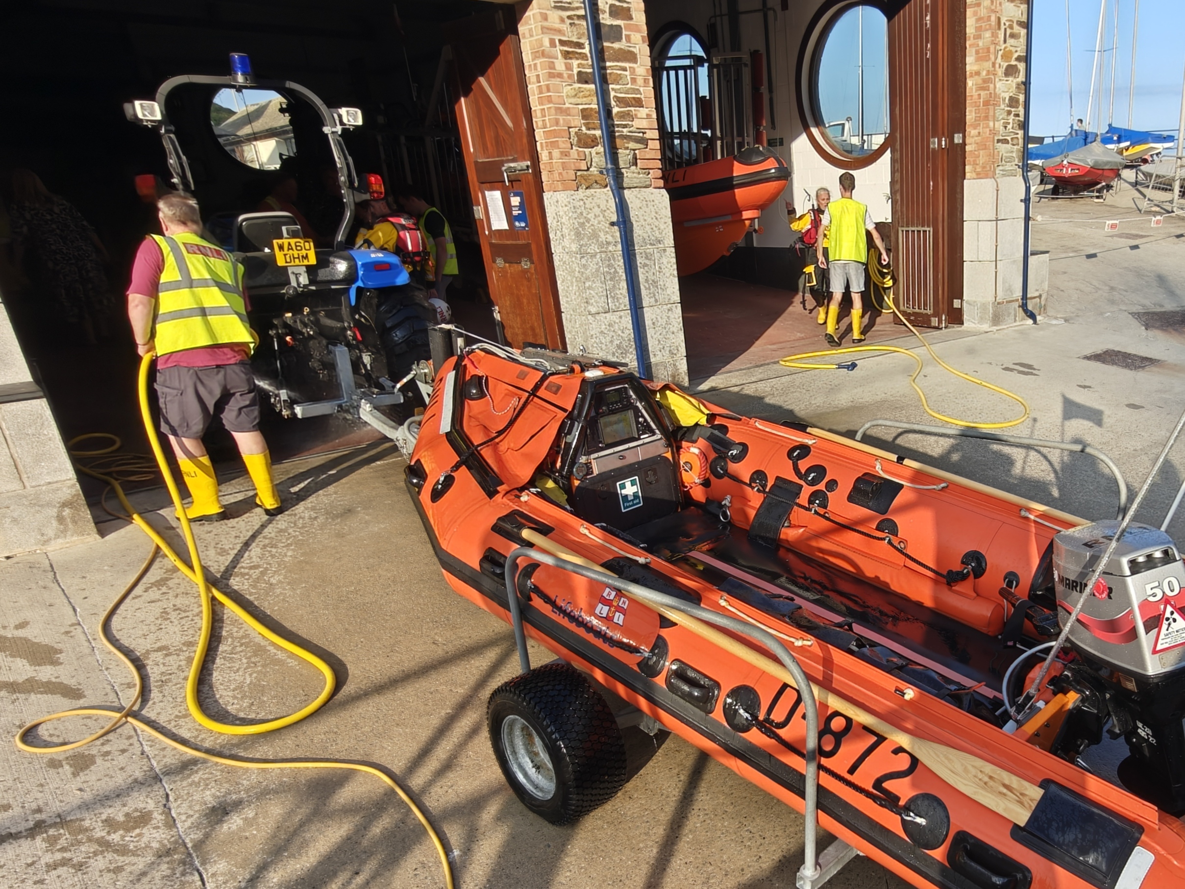 Shore crew washing down the D Class ILB Ollie Naismith II after returning from Plaidy
