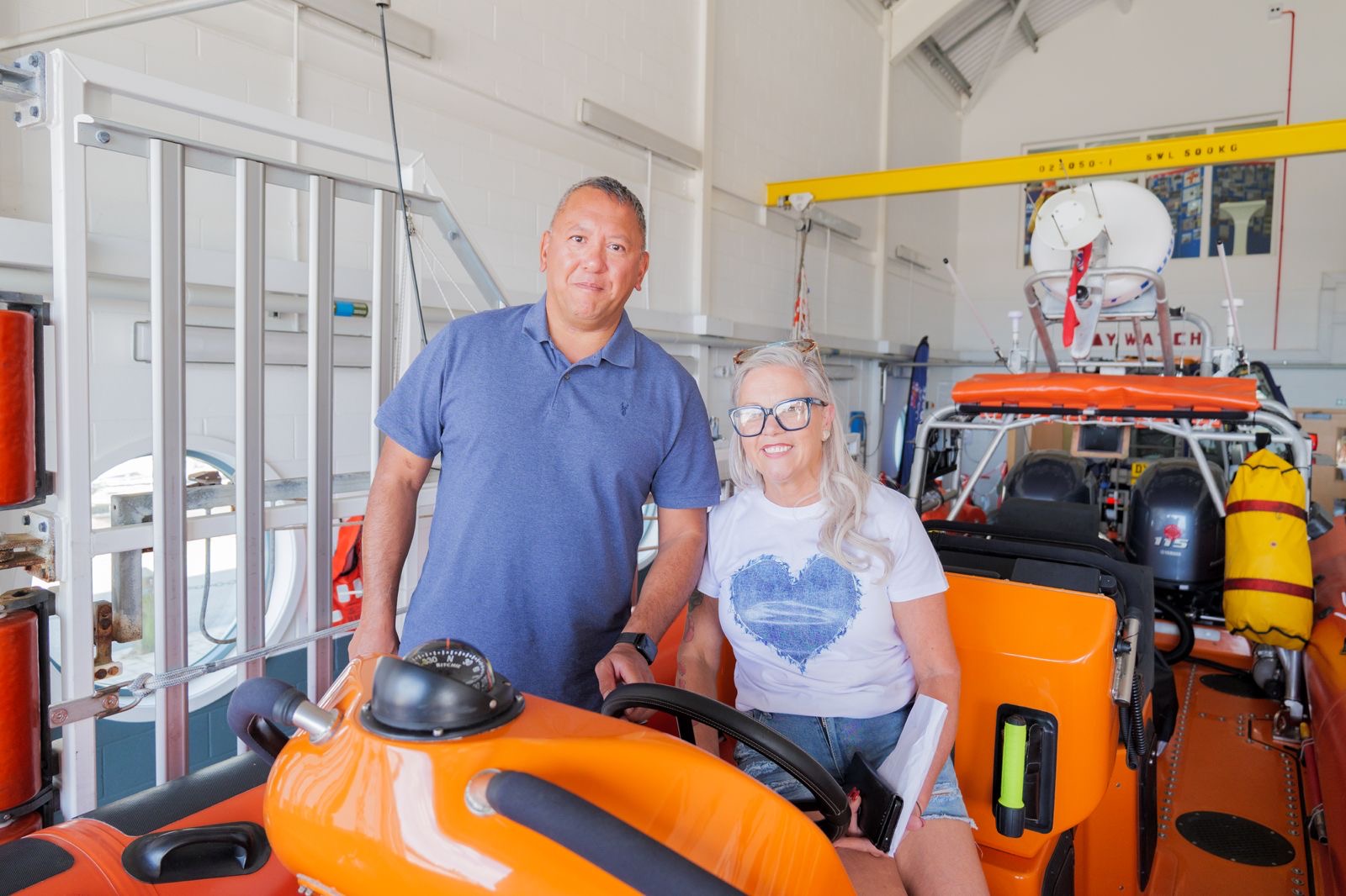 Leah in the driving seat with her husband alongside