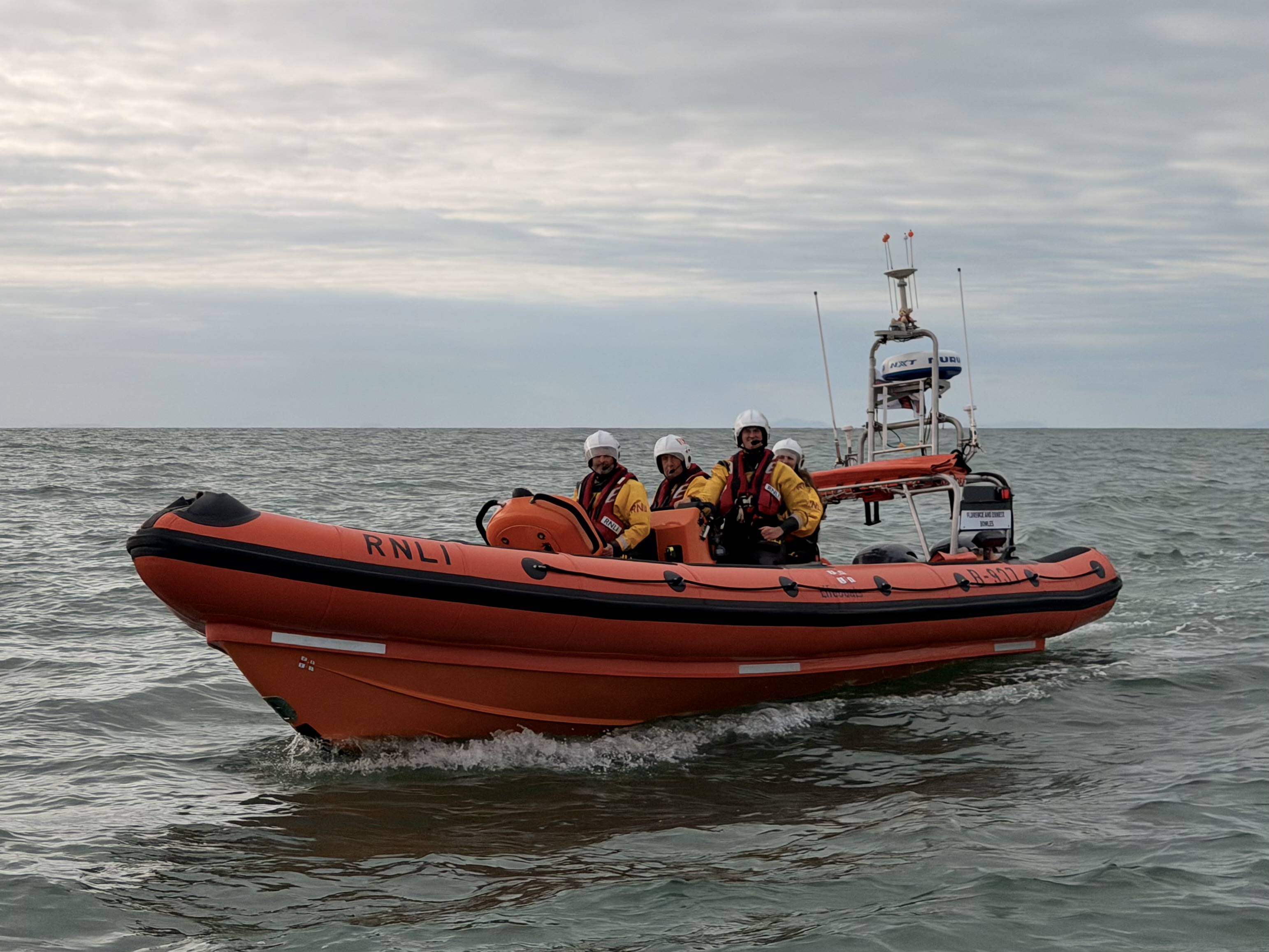 Aberystwyth’s Atlantic 85 lifeboat on a calm sea in the evening.