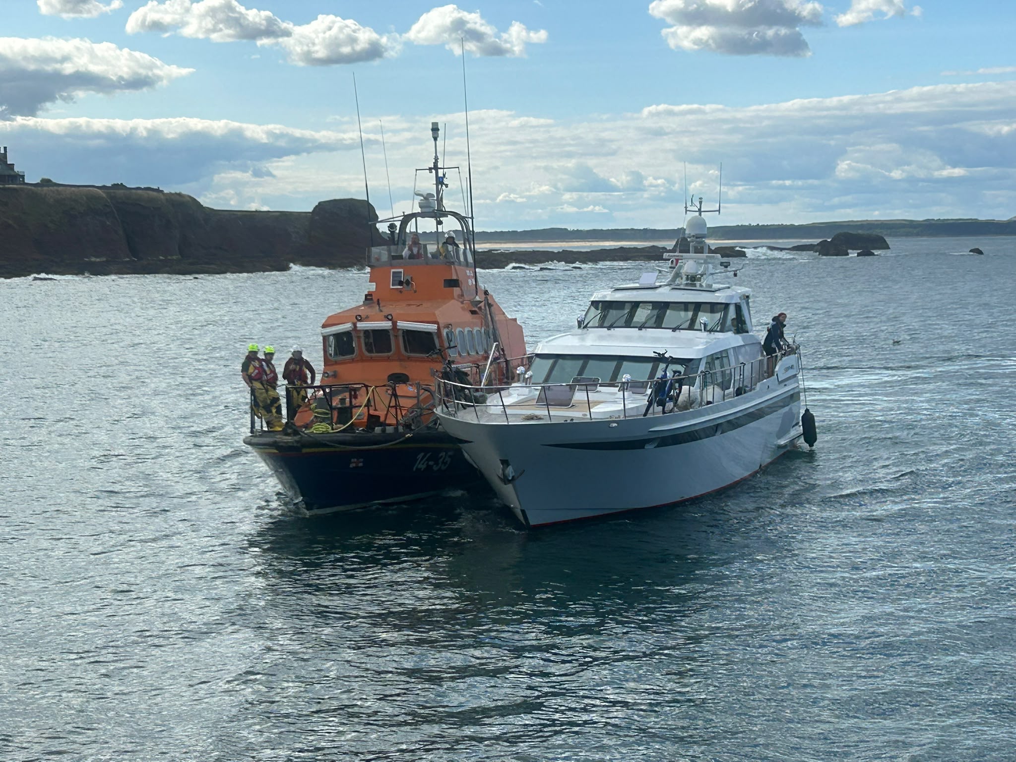 Two boats tied together.